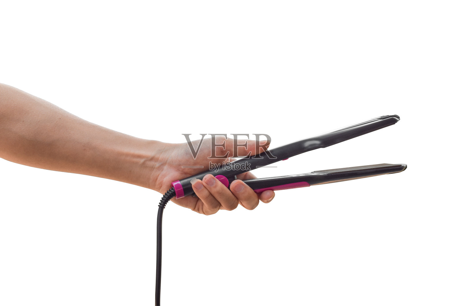 手持电动卷发器孤立在白色背景上。剪切路径。照片摄影图片