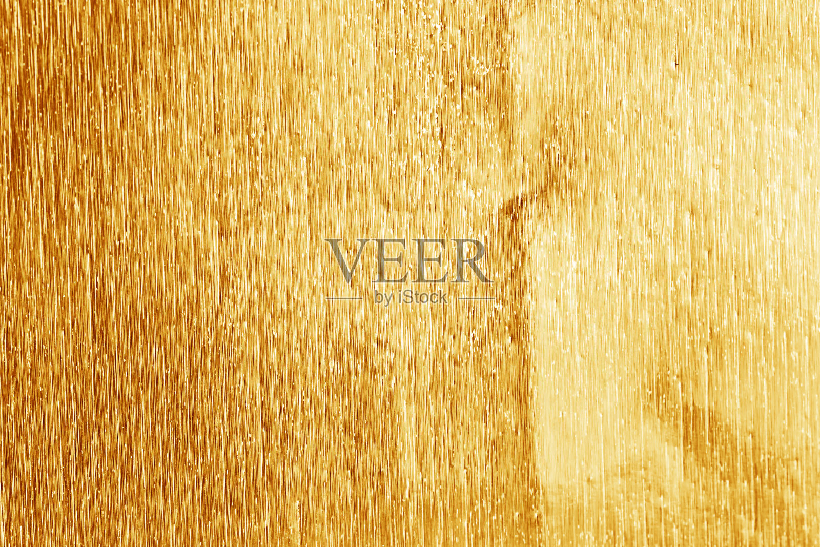 闪亮的黄色金箔纹理为背景和阴影。黄金的背景照片摄影图片