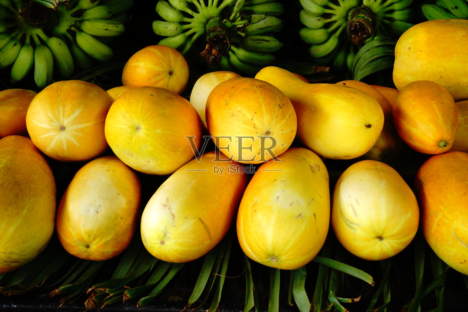 ํ黄色甜瓜卖照片摄影图片