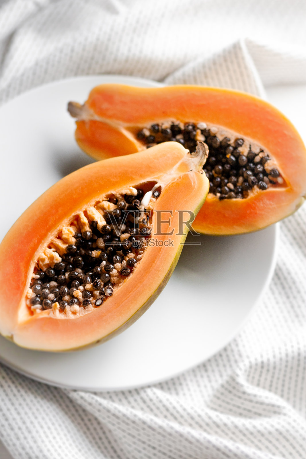 鲜橙热带木瓜。照片摄影图片