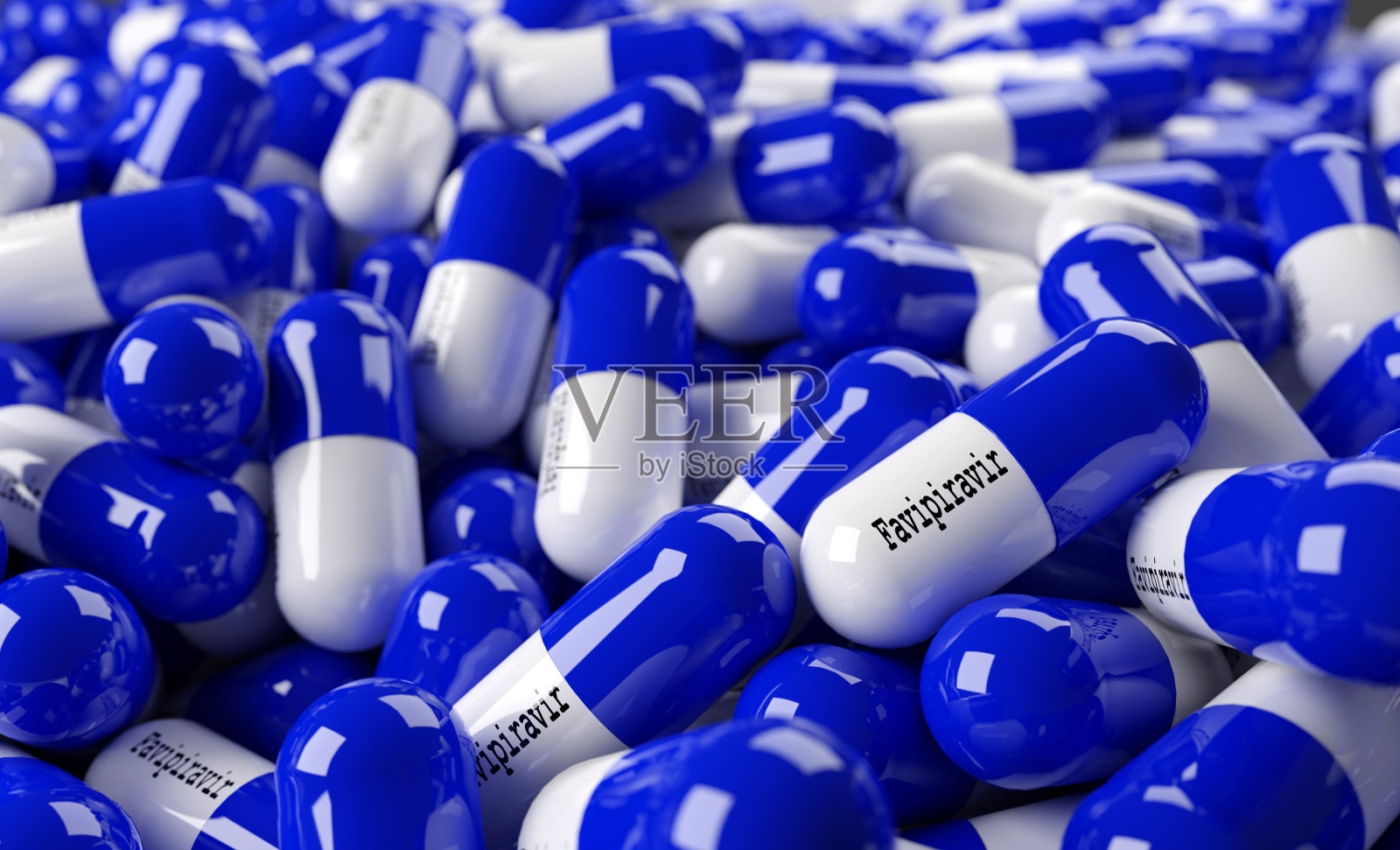 近距离观察多色表面刻有法匹拉韦字样的胶囊或药丸。病毒大流行防护概念。冠状病毒或COVID-19概念。三维渲染照片摄影图片