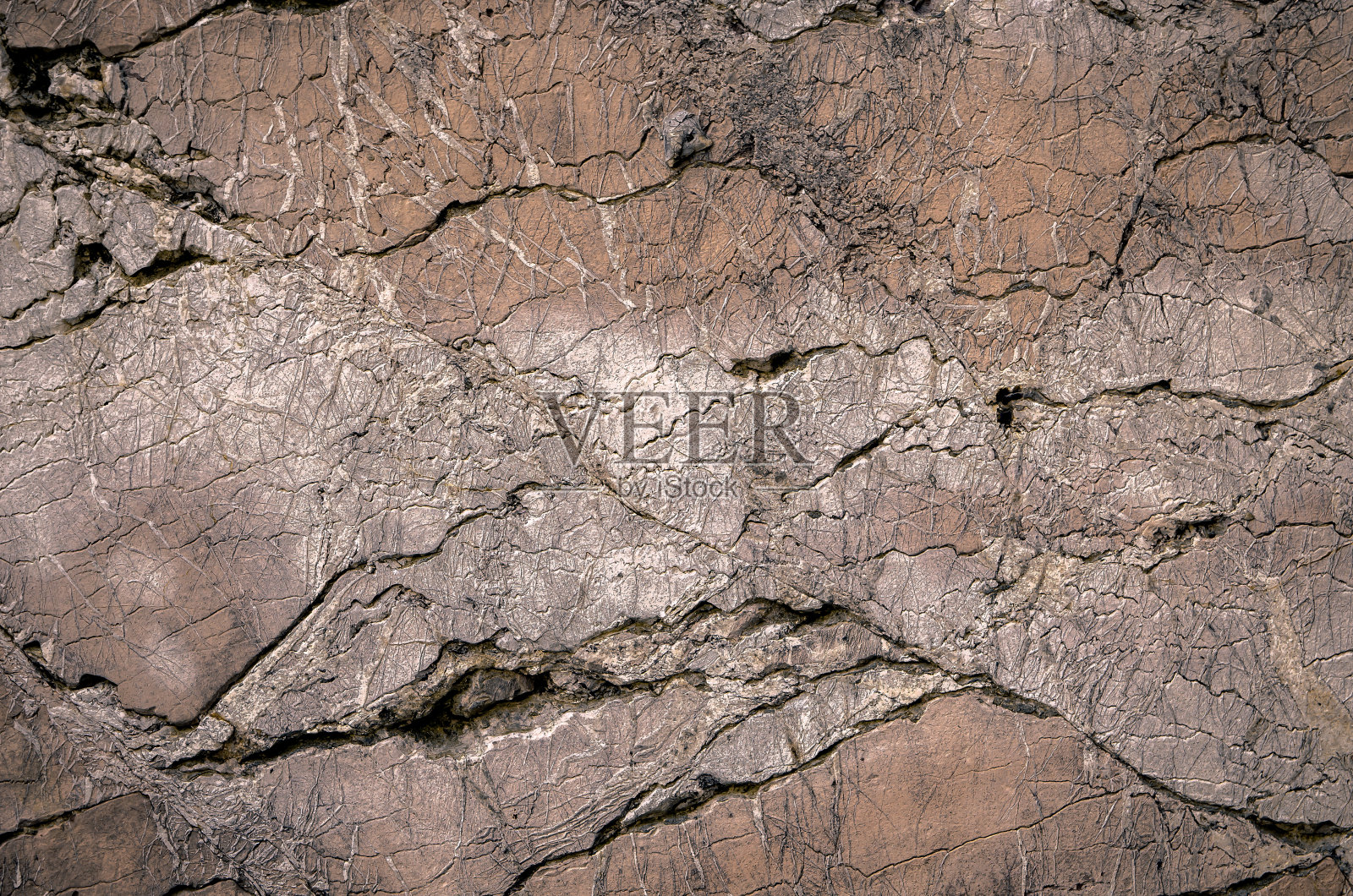 古老的裂裂碎裂的石头背景纹理。照片摄影图片
