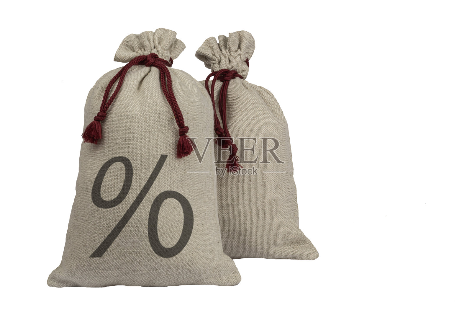 两袋带百分比符号的粗布。照片摄影图片