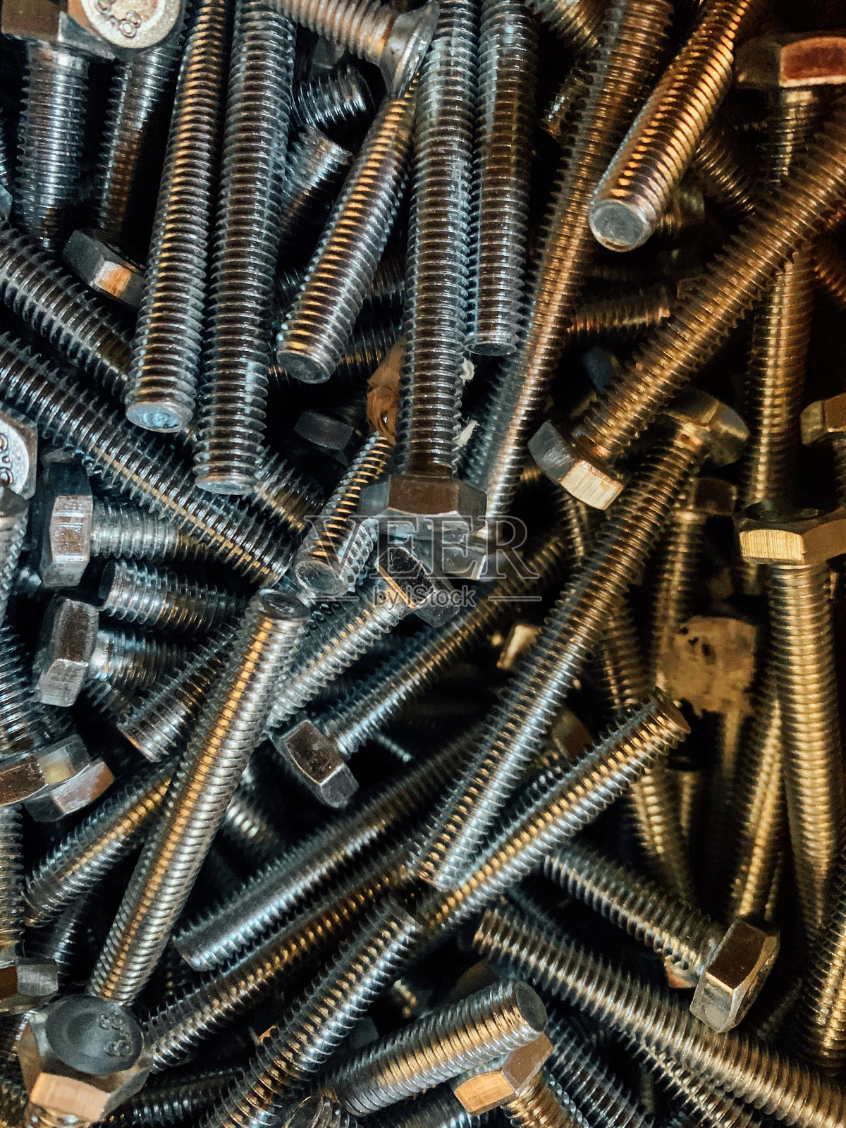 以大量金属螺栓的施工和维修为背景照片摄影图片