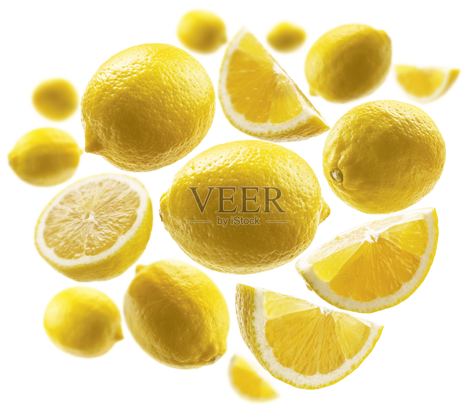 黄色的柠檬漂浮在白色的背景上照片摄影图片