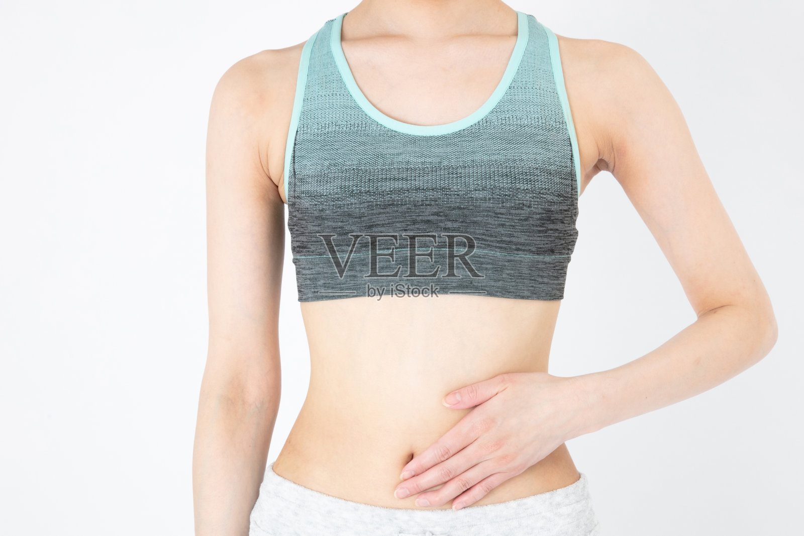 饮食的形象。女性的腹部和腰部。照片摄影图片