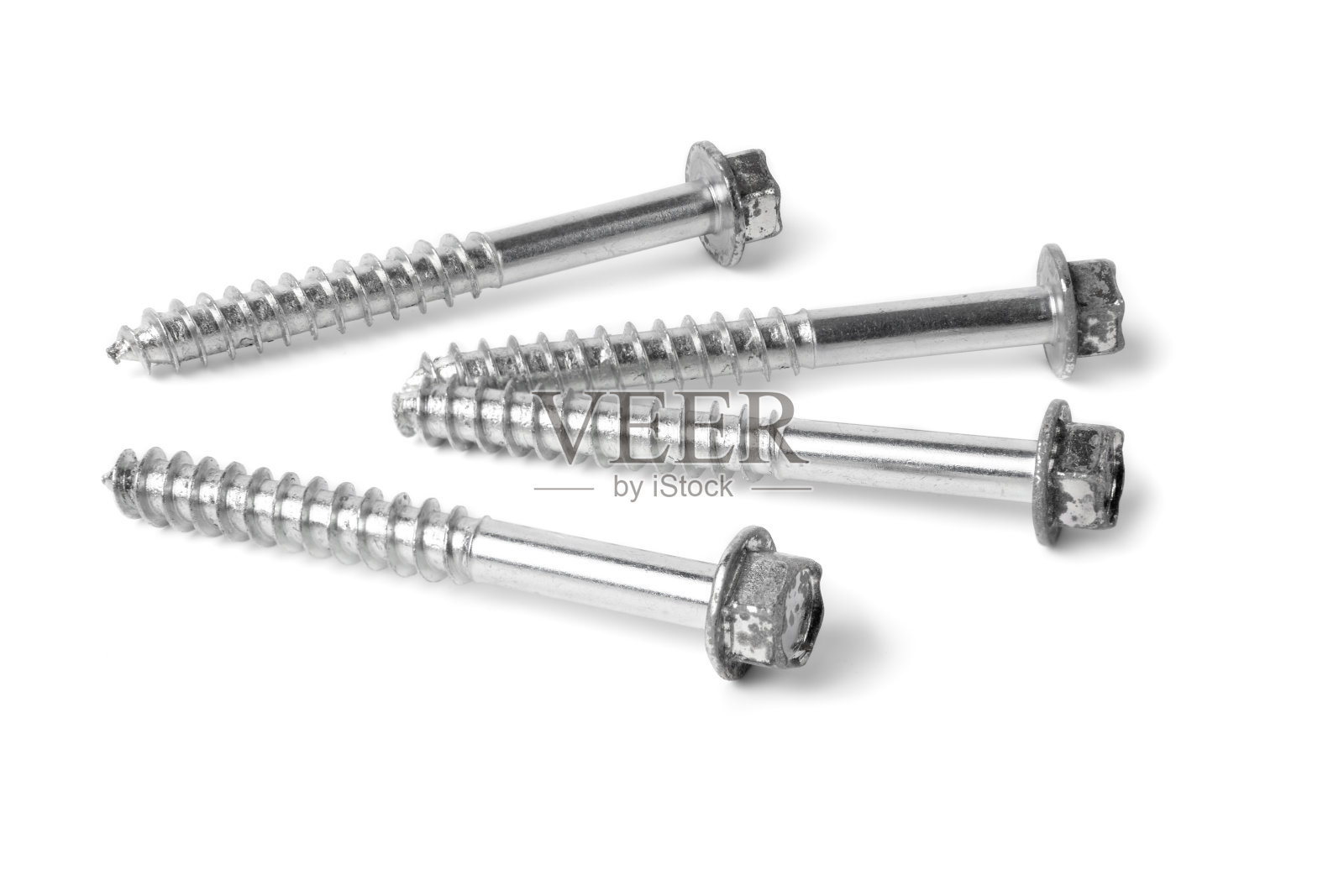 近亮螺栓，钢镀锌六角头隔离在白色背景，螺钉用于钣金照片摄影图片