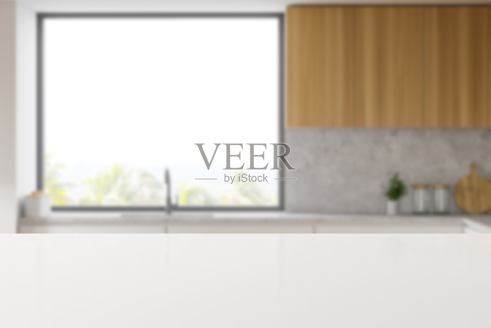 桌子在模糊的白色厨房与水槽和窗户照片摄影图片