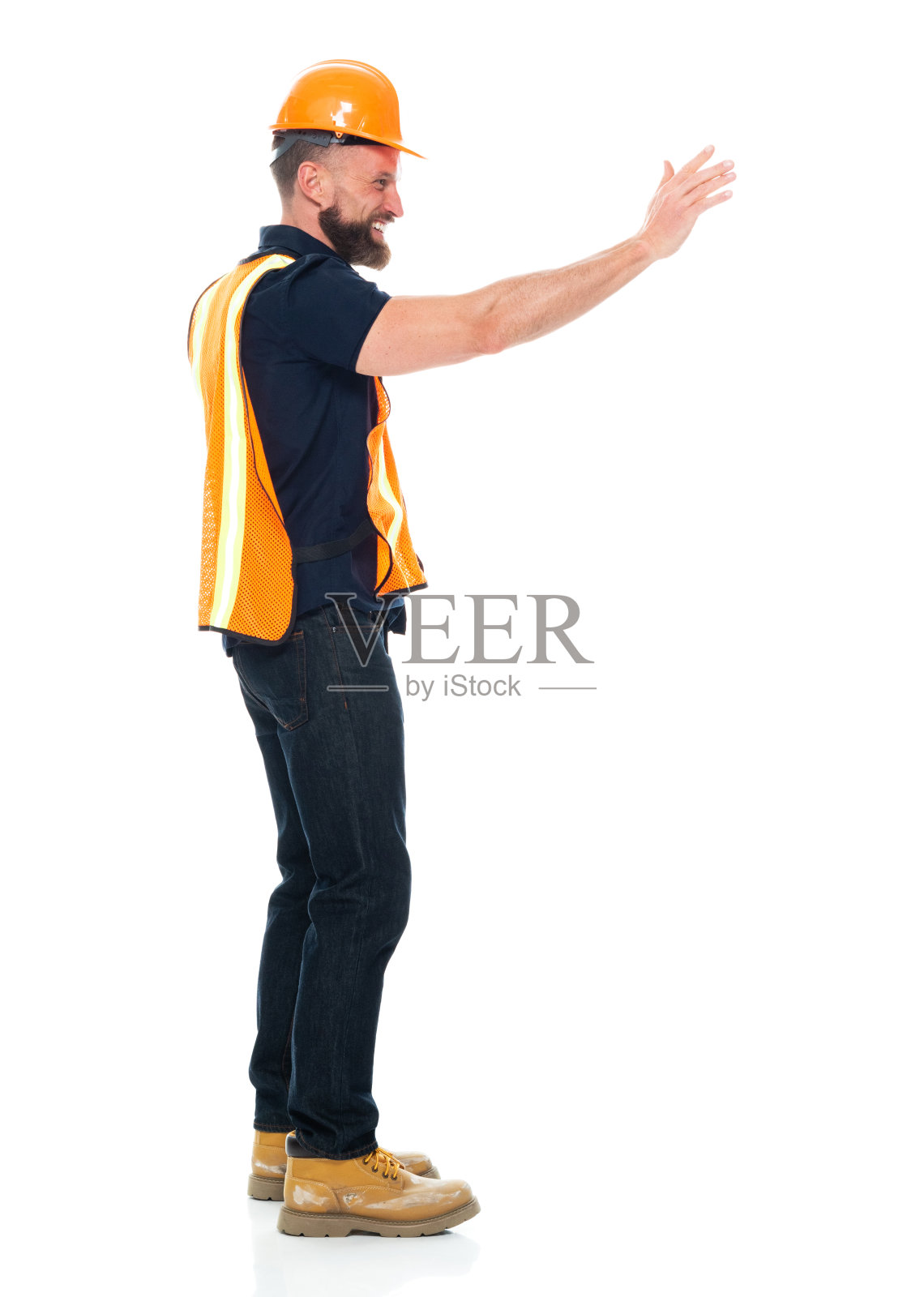 建筑工人穿着裤子拿着锤子修理照片摄影图片