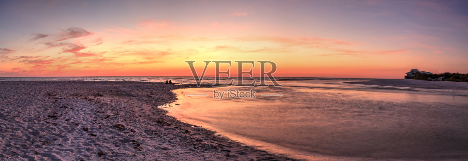 日落的海滩作为一个水道的蛤蜊Pass照片摄影图片