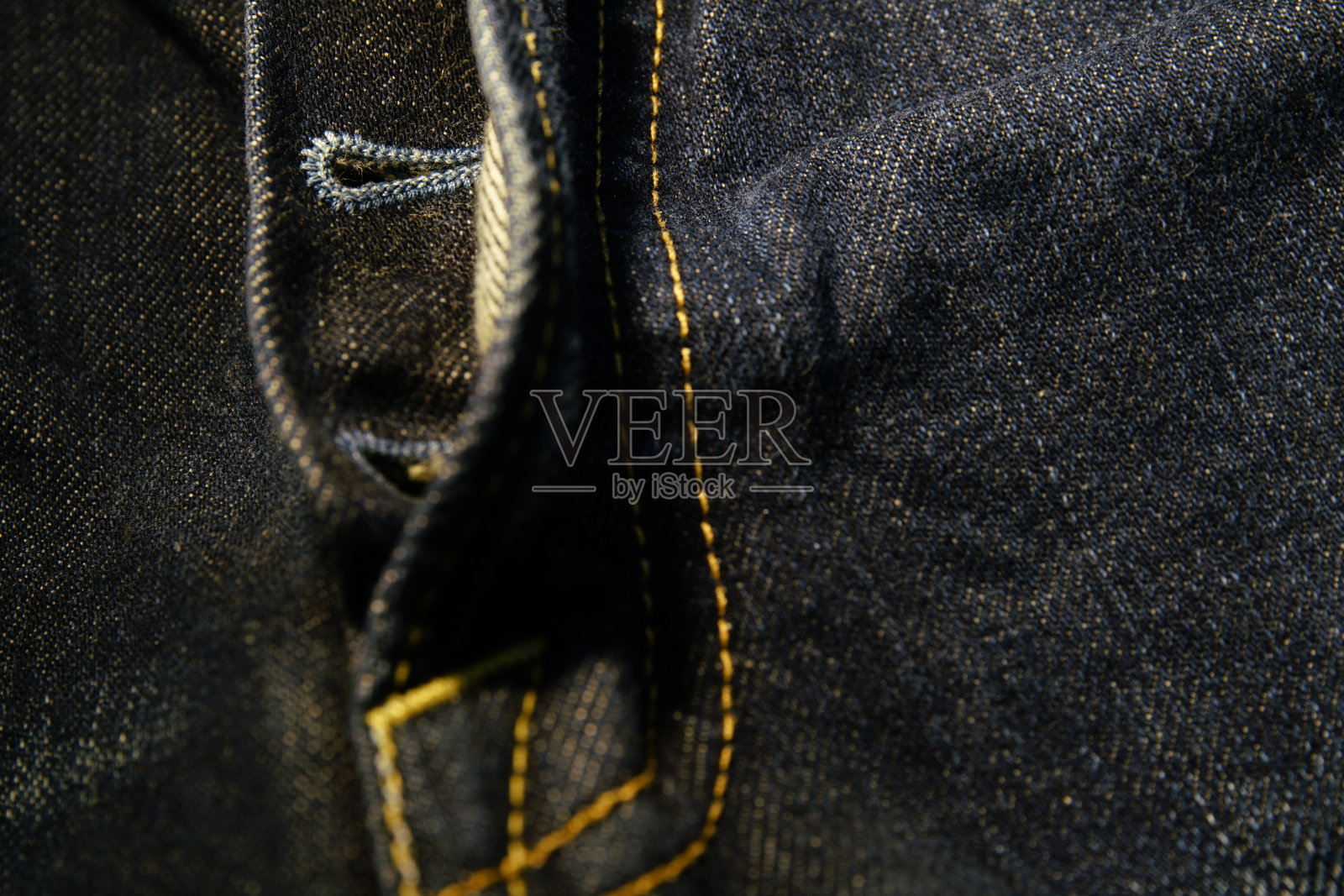 一个接近纹理背景的蓝色牛仔裤织物空白空间照片摄影图片