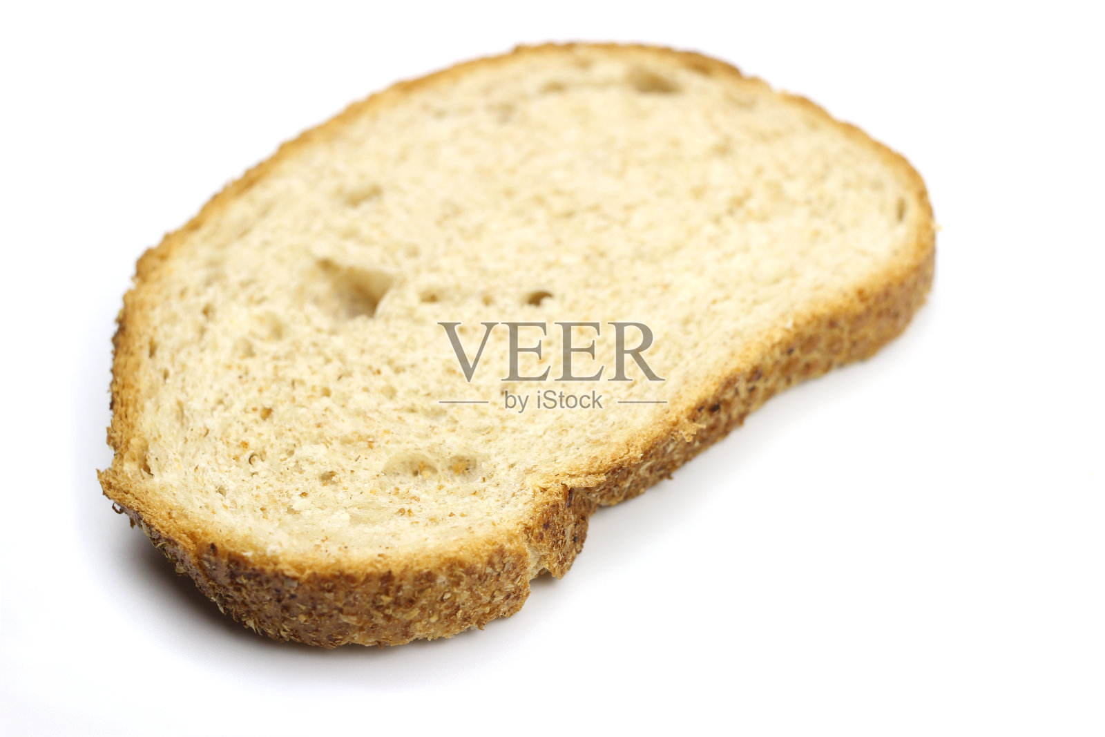 一片面包被孤立在白色的背景上照片摄影图片