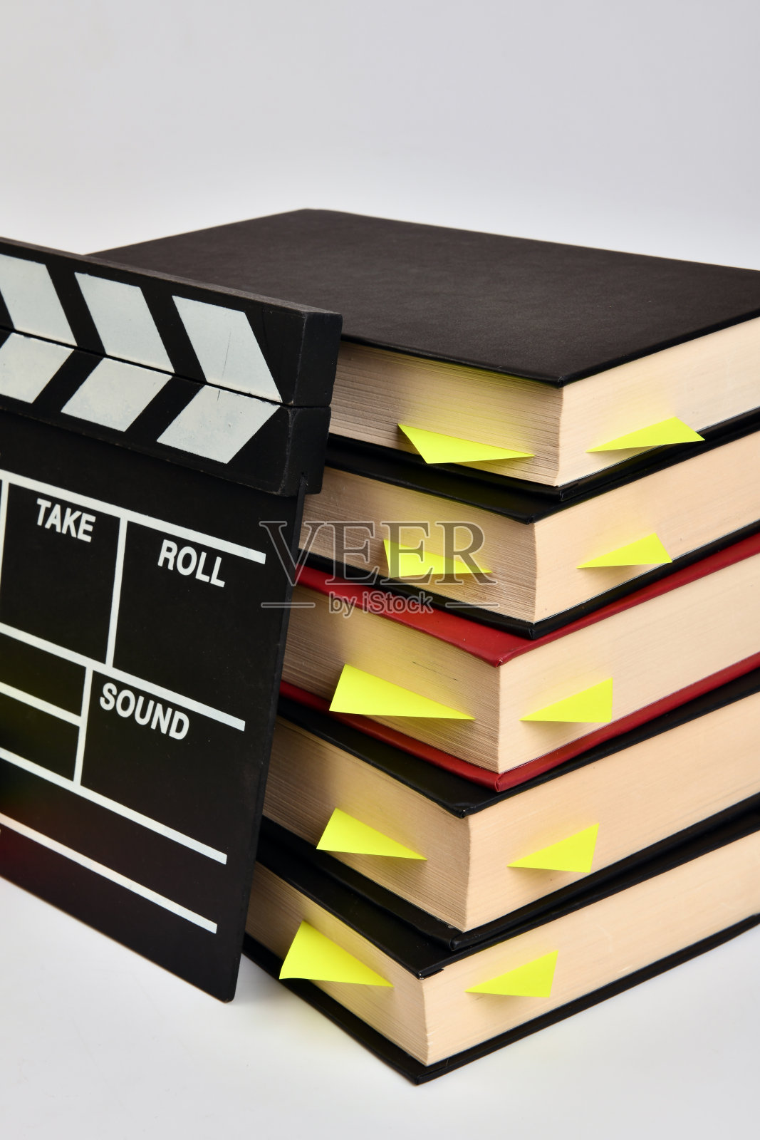 拍板和书。照片摄影图片