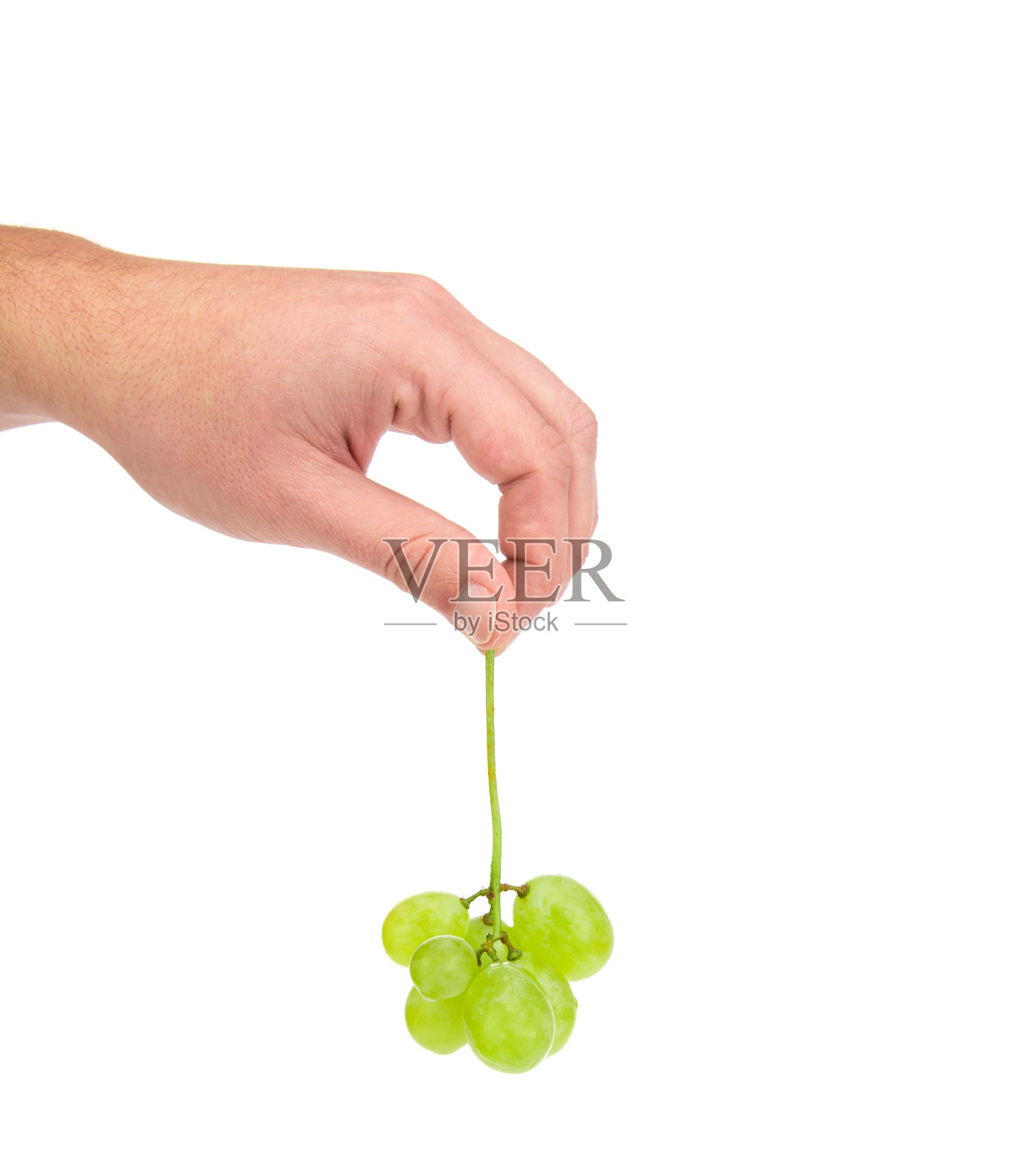 手握着葡萄。照片摄影图片
