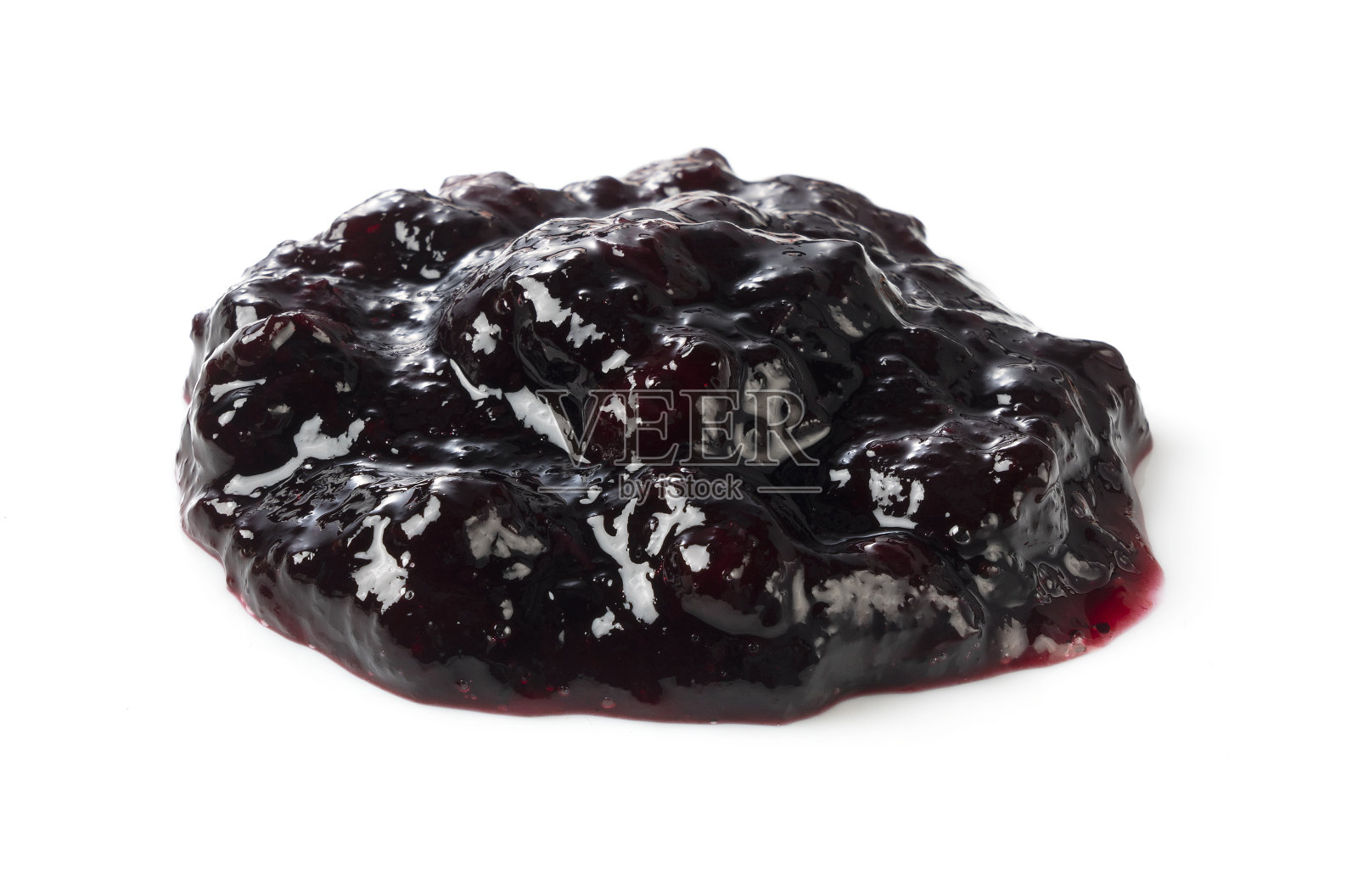 蓝莓酱滴在白色的背景上照片摄影图片