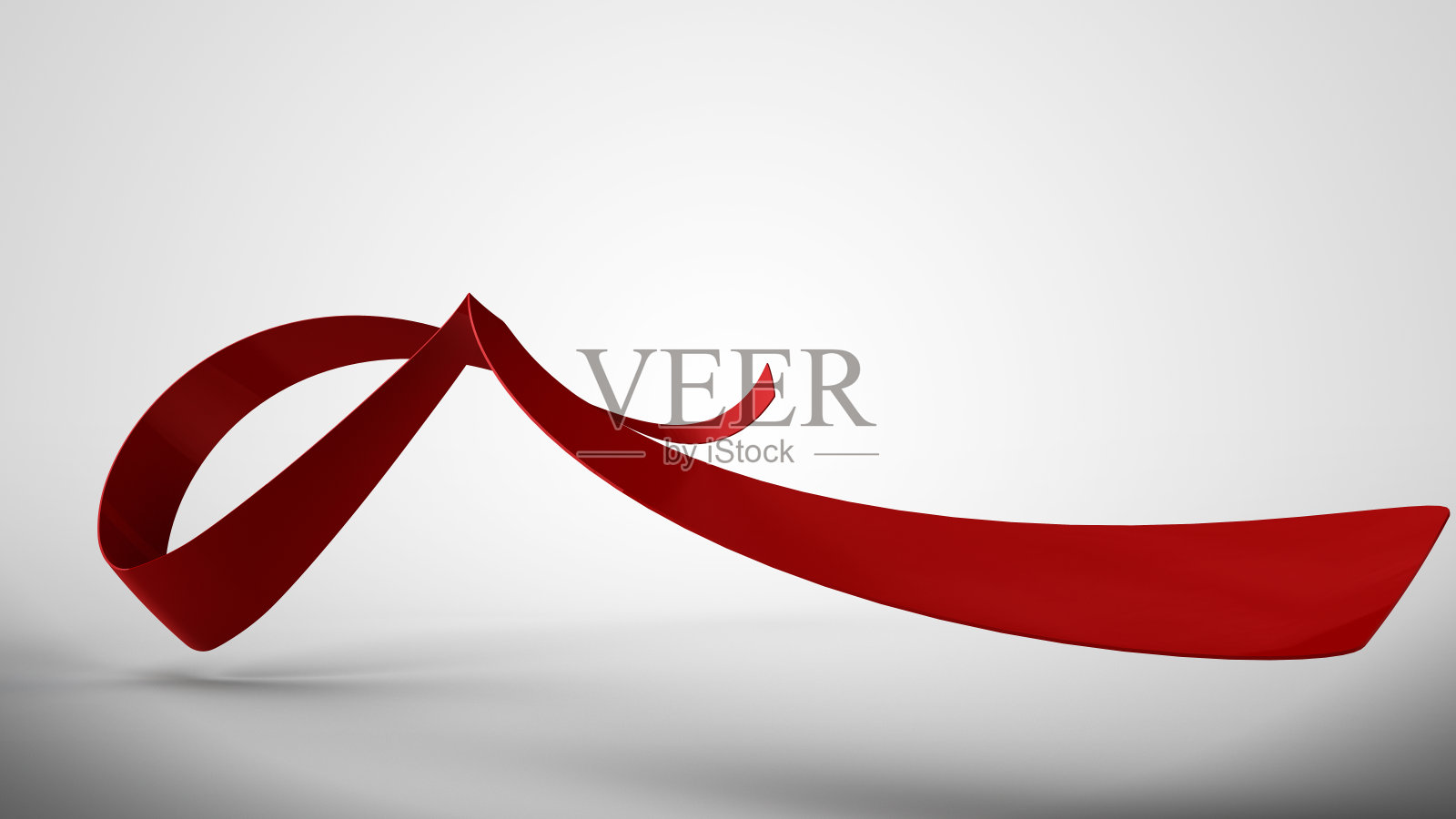 白色背景上的红色卷曲缎带照片摄影图片