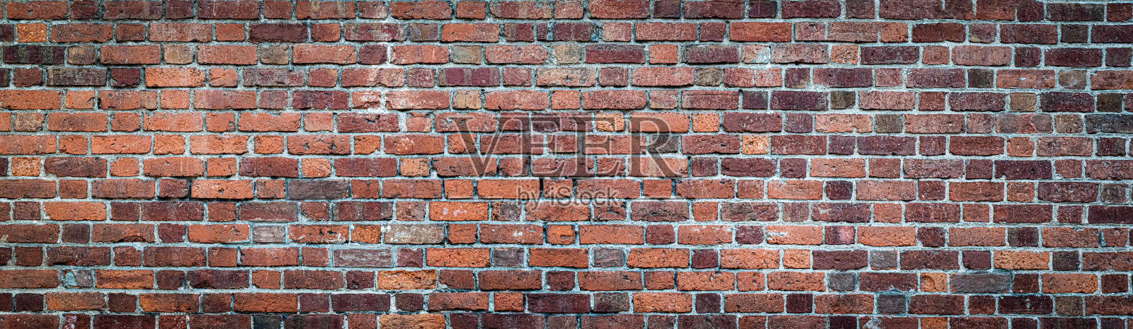 棕色和红色的砖墙。纹理的老风化砖墙全景背景。照片摄影图片