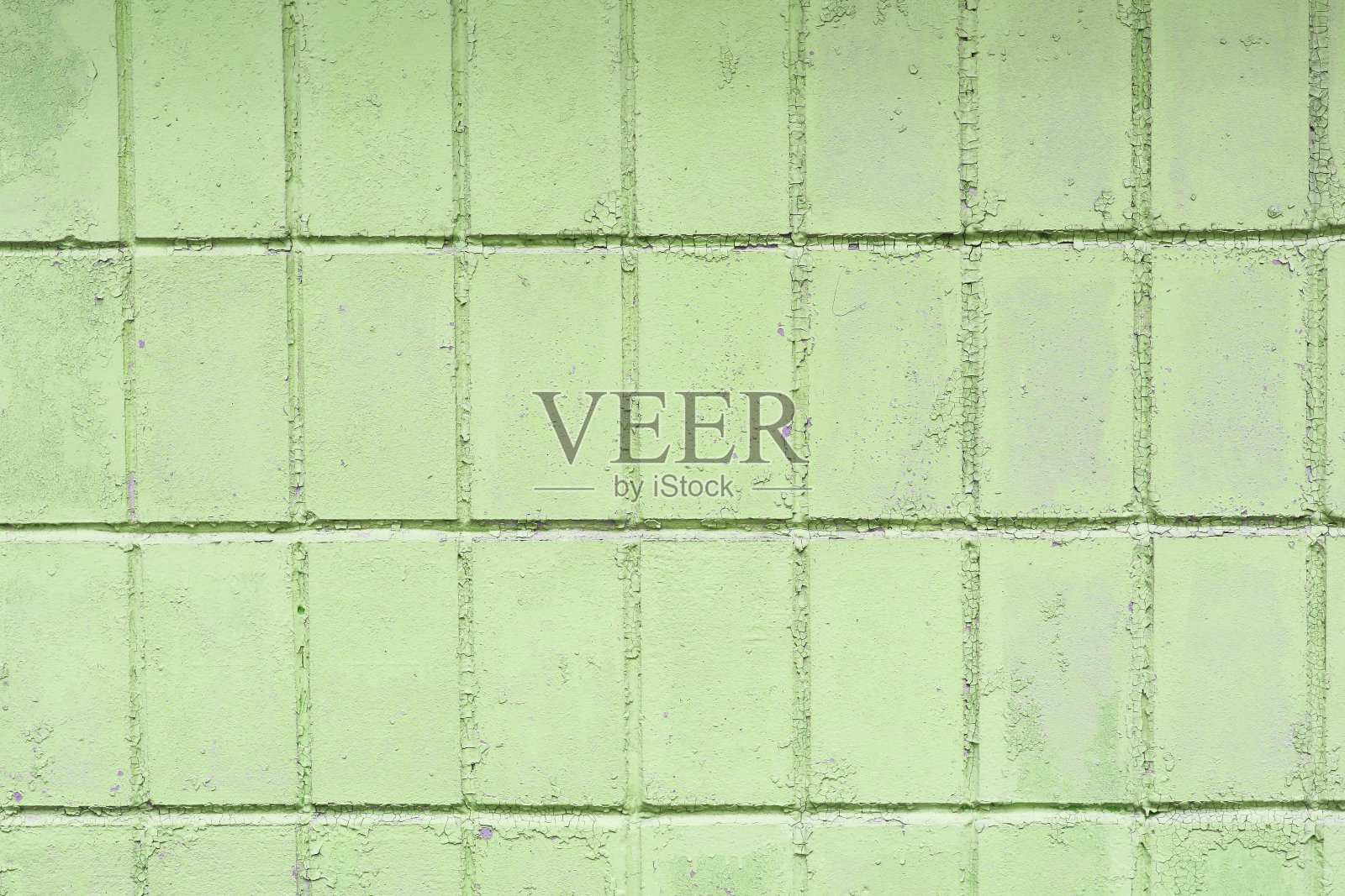 复古的绿色背景与旧的绿色油漆与粗糙的表面，条纹和不均匀的纹理的绿色油漆在一个旧的粗糙表面照片摄影图片