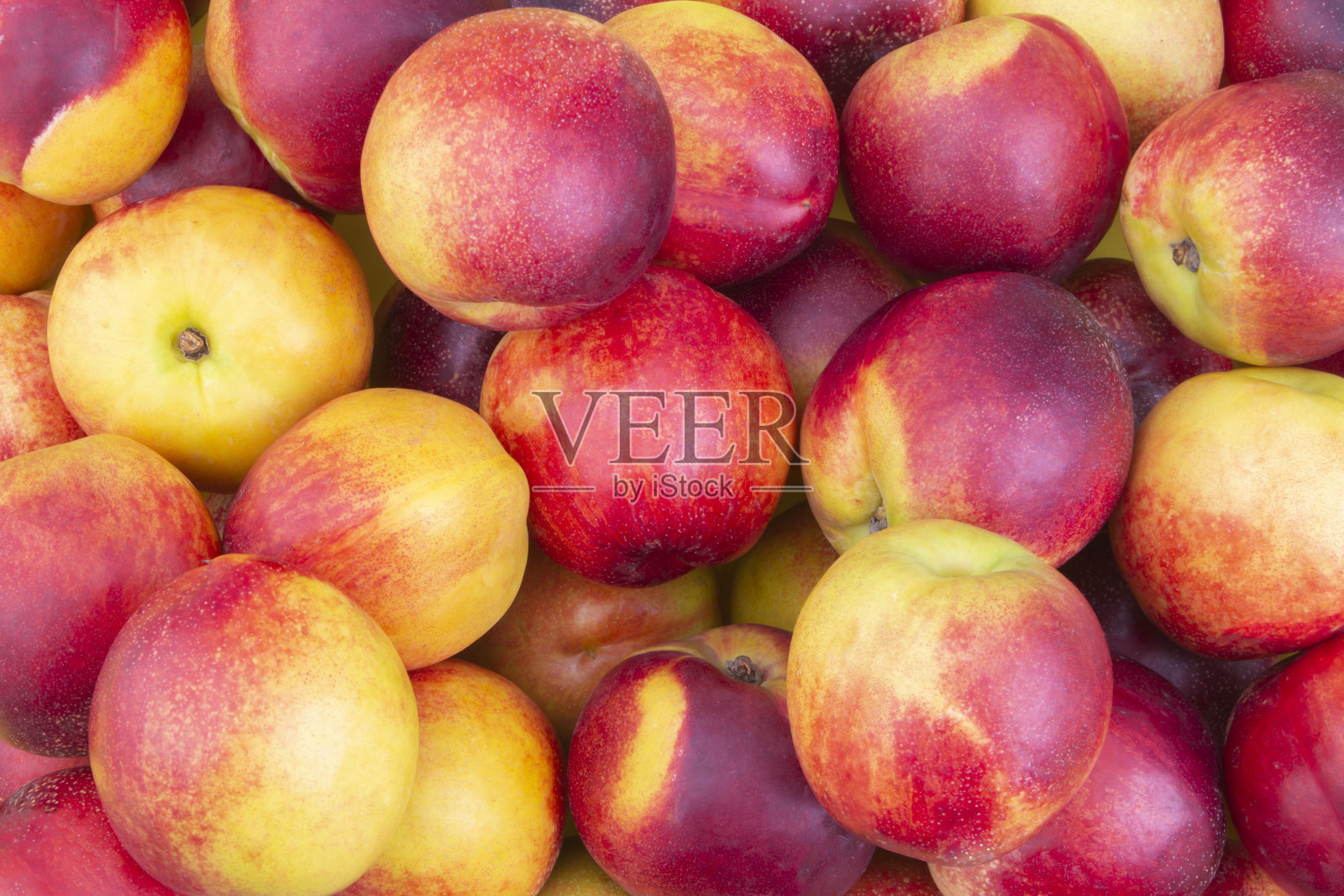 新鲜成熟的油桃背景照片摄影图片