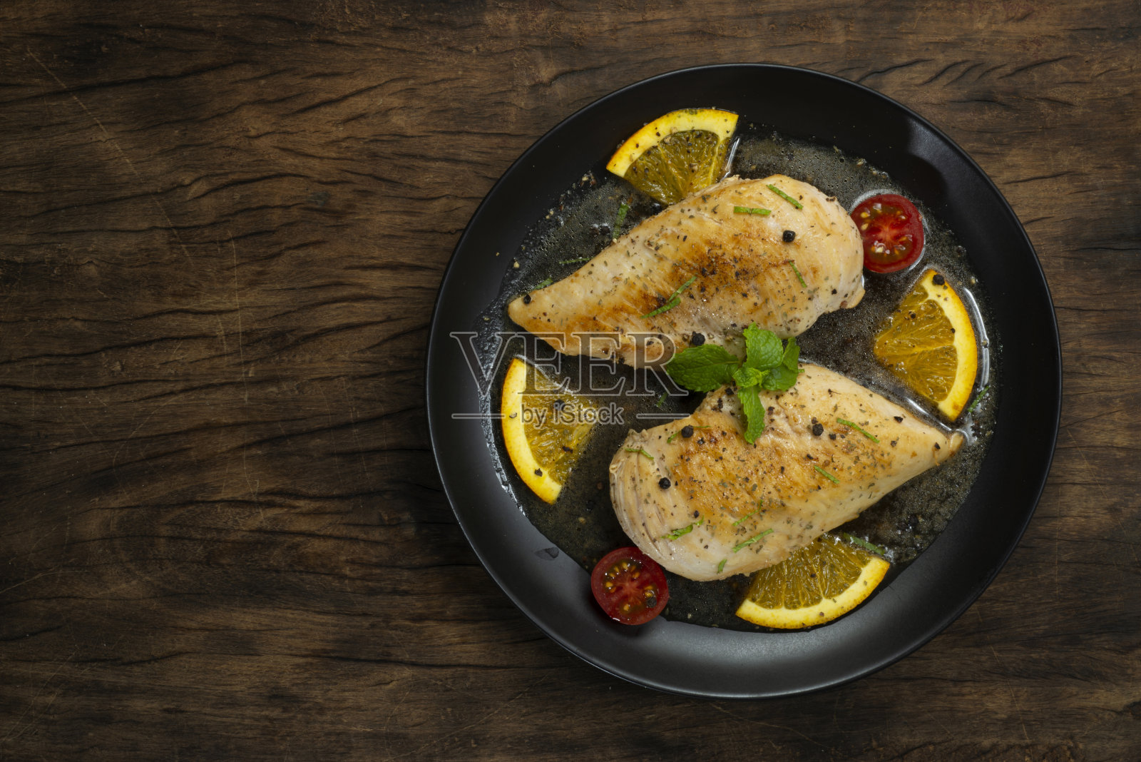 香辣鸡配橙汁黄油酱照片摄影图片