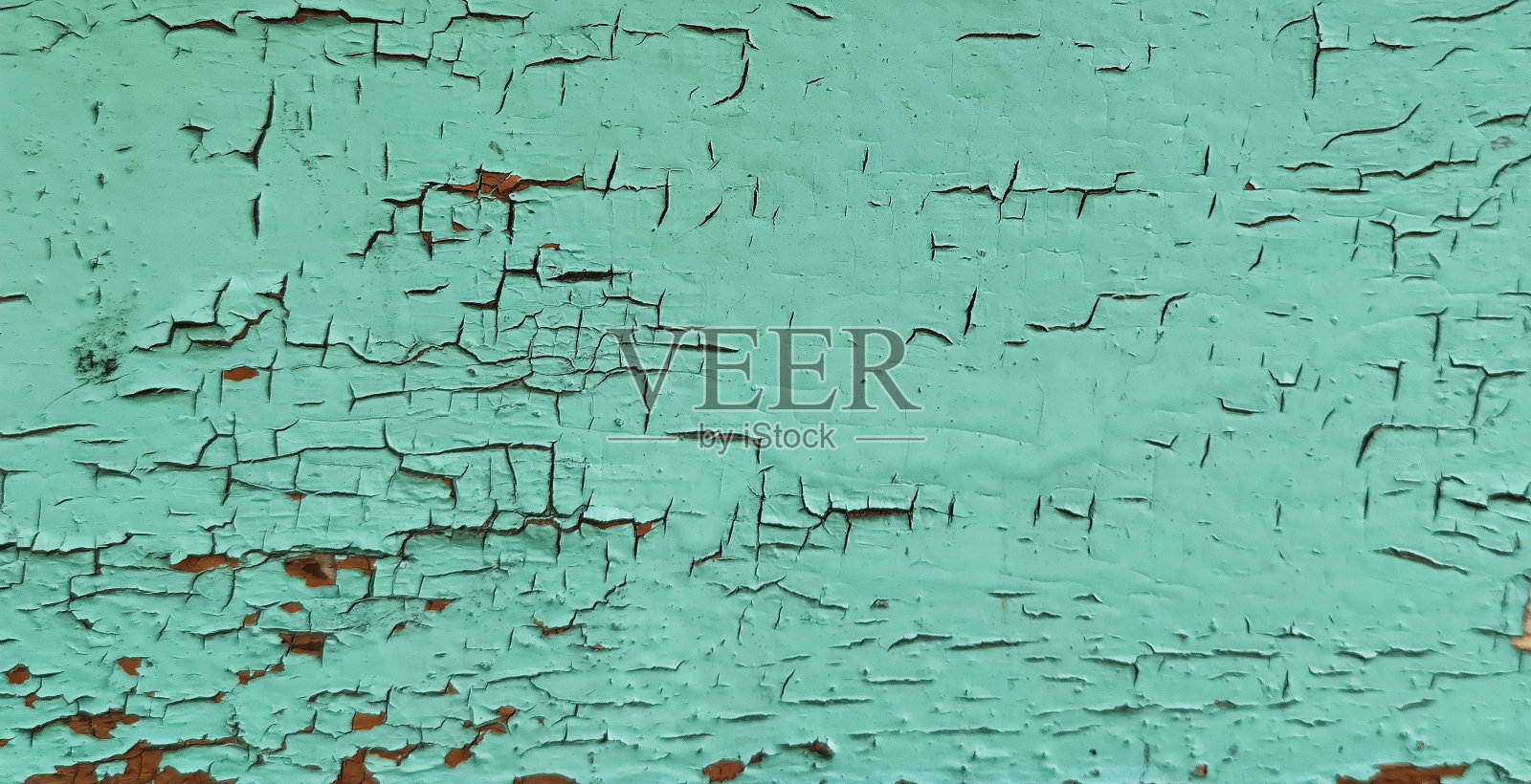 绿蓝墙壁上的纹理。老风化油漆照片摄影图片