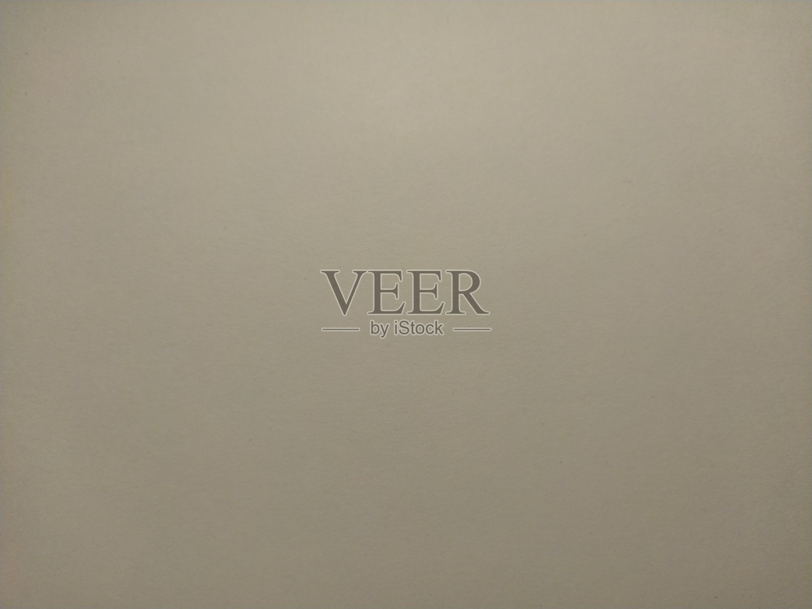 一张米色的纸，在左下角有一个背光照片摄影图片