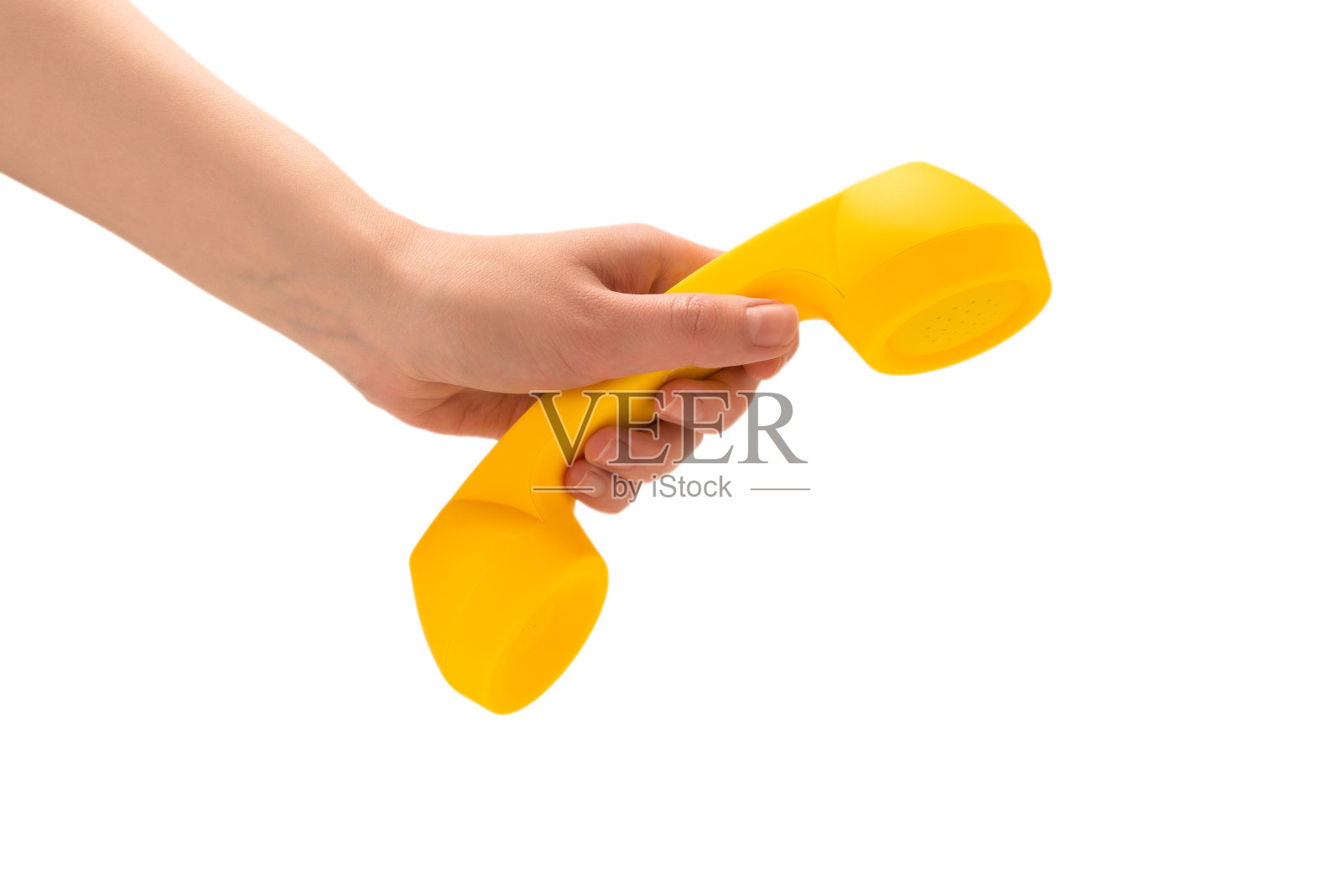 黄色手机在女人手上孤立在白色。照片摄影图片