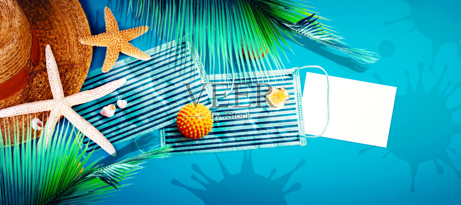 戴着海星和冠状病毒口罩度假的帽子照片摄影图片