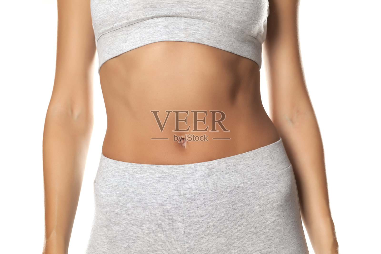 在运动胸罩和紧身裤的女人躯干照片摄影图片