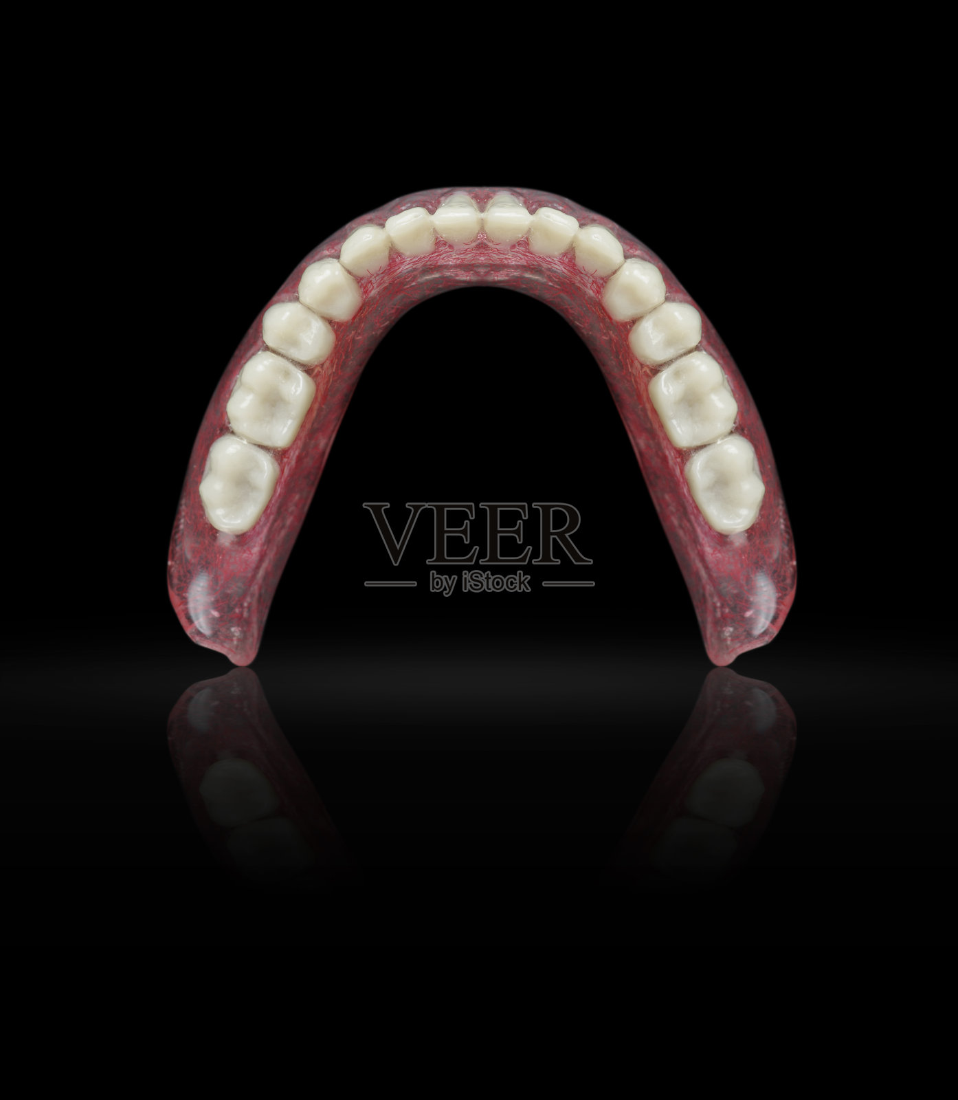 黑色背景上的假牙套装照片摄影图片