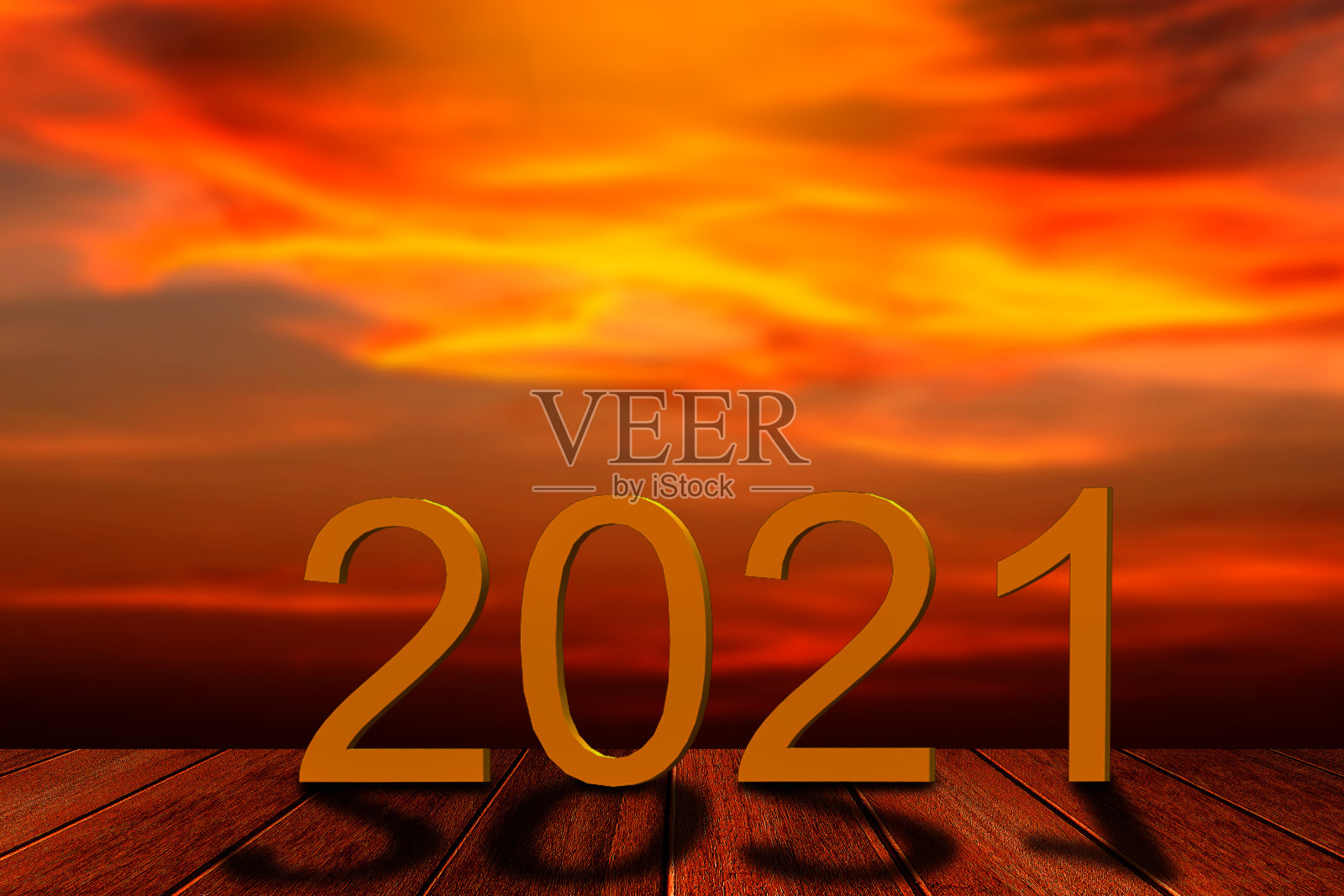 新年概念，在沙滩上模糊的日落天空背景上的2021文字。照片摄影图片