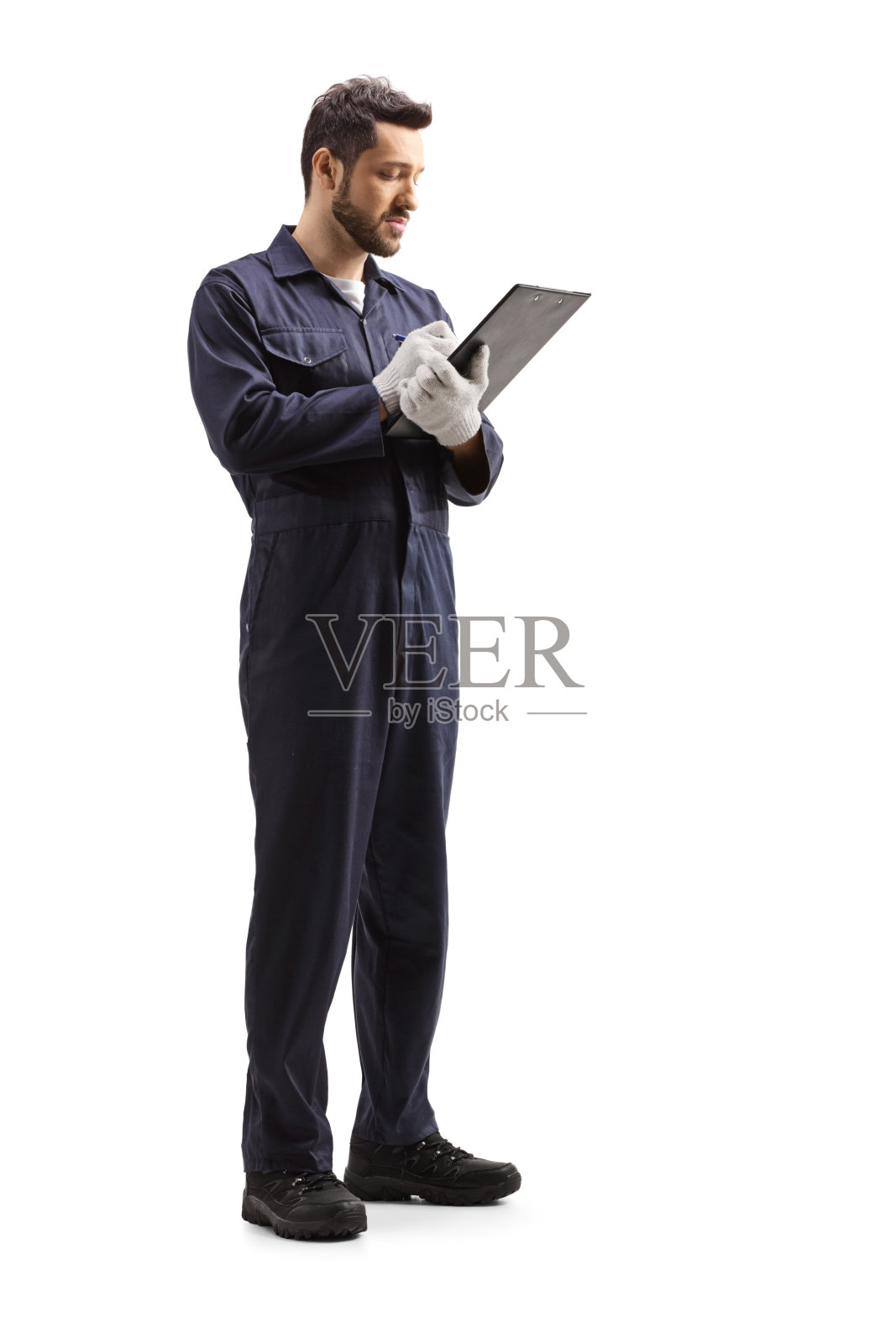 一名男性工人写文件的完整长度镜头照片摄影图片