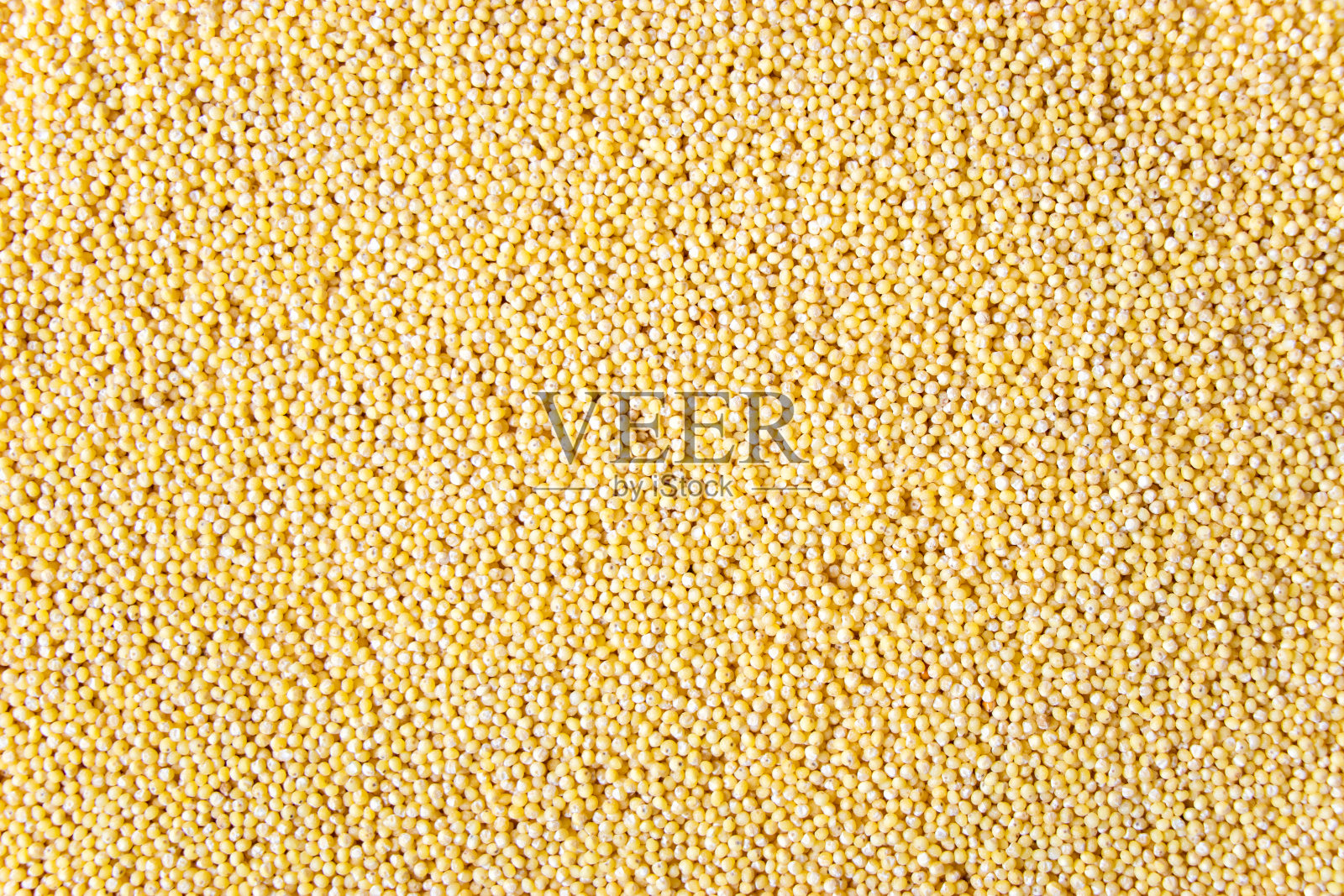 黄粟粒质地，复制空间。黄色背景照片摄影图片