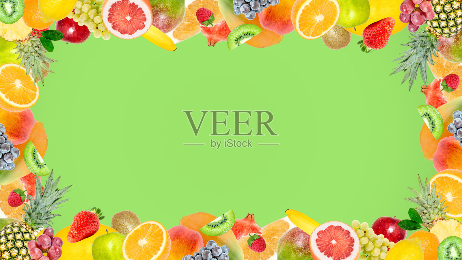 创意照片许多不同的异国情调的热带明亮的水果框架在夏季的绿色背景。从以上观点。明亮的夏季水果图案与复制空间。照片摄影图片