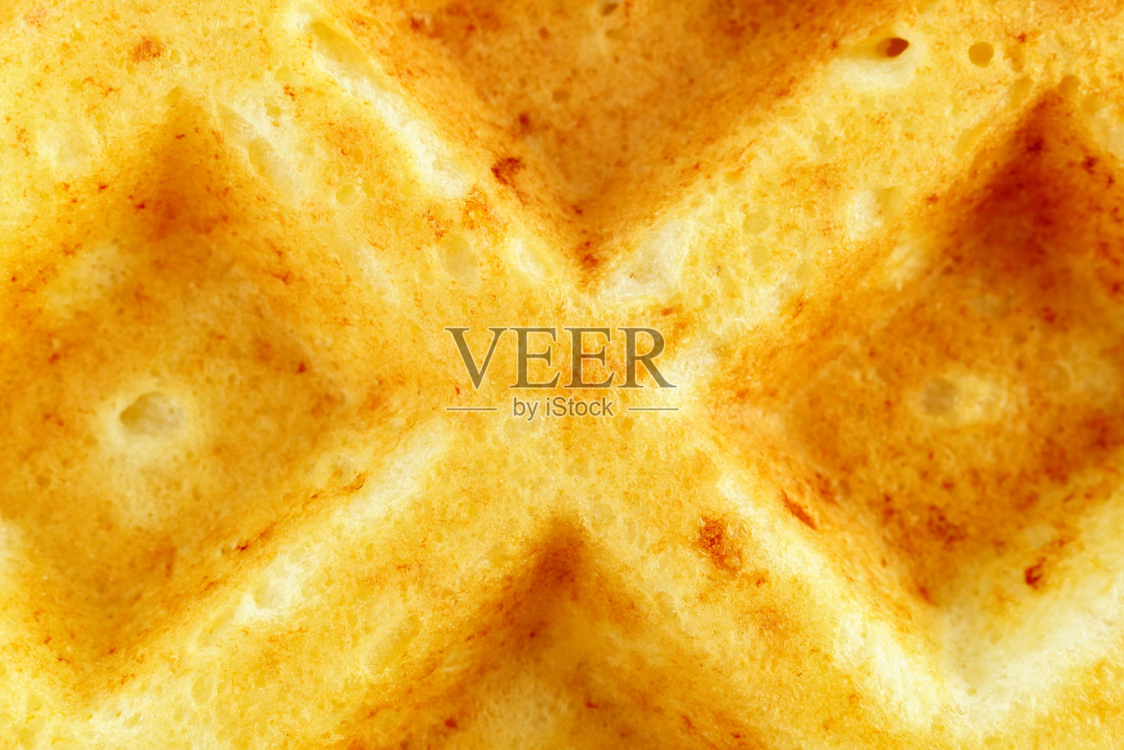 华夫饼比利时的，松软的或鸡蛋华夫饼。特写传统的欧洲甜点。食物背景宏观纹理表面。照片摄影图片