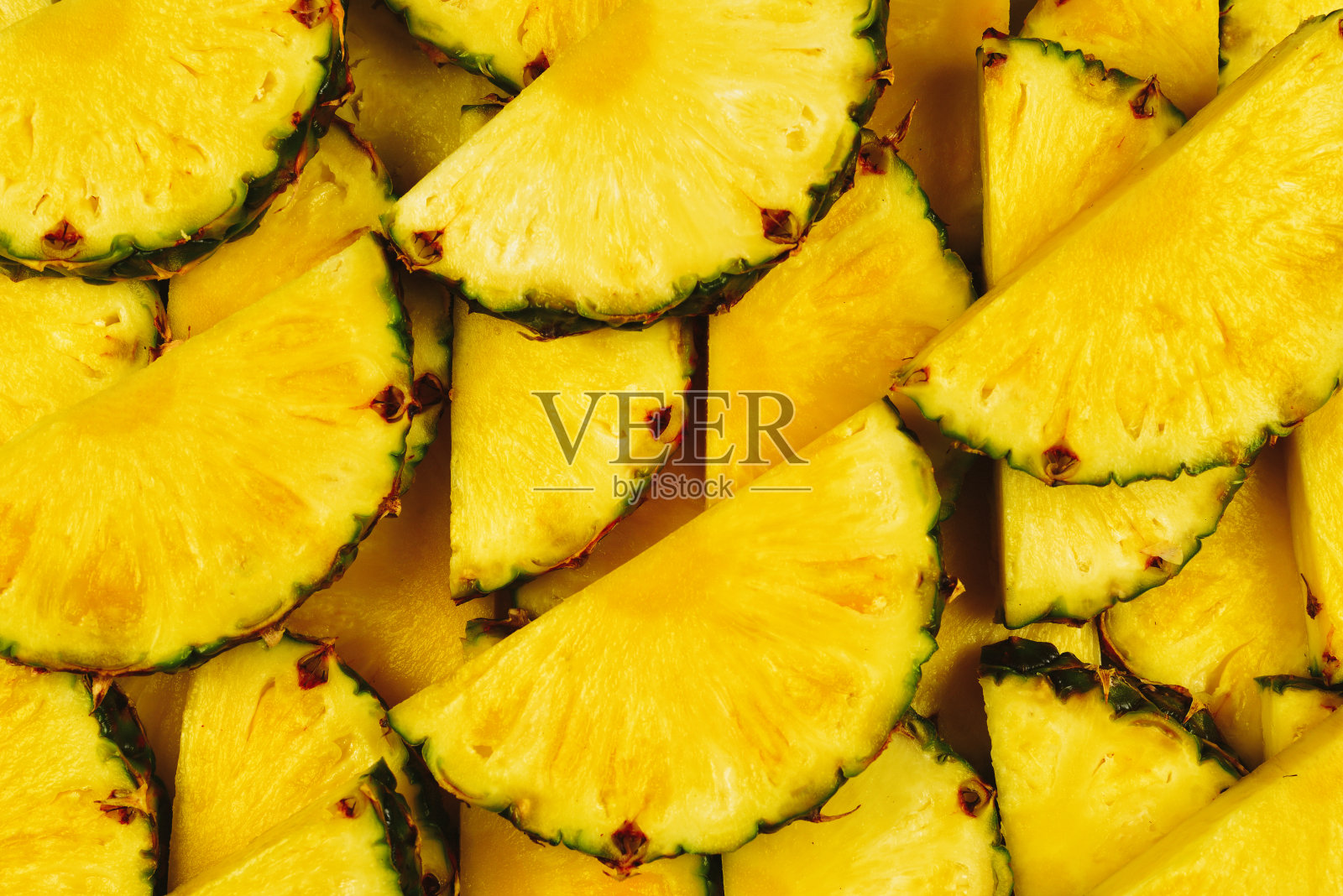 菠萝汁黄色切片背景。前视图。照片摄影图片