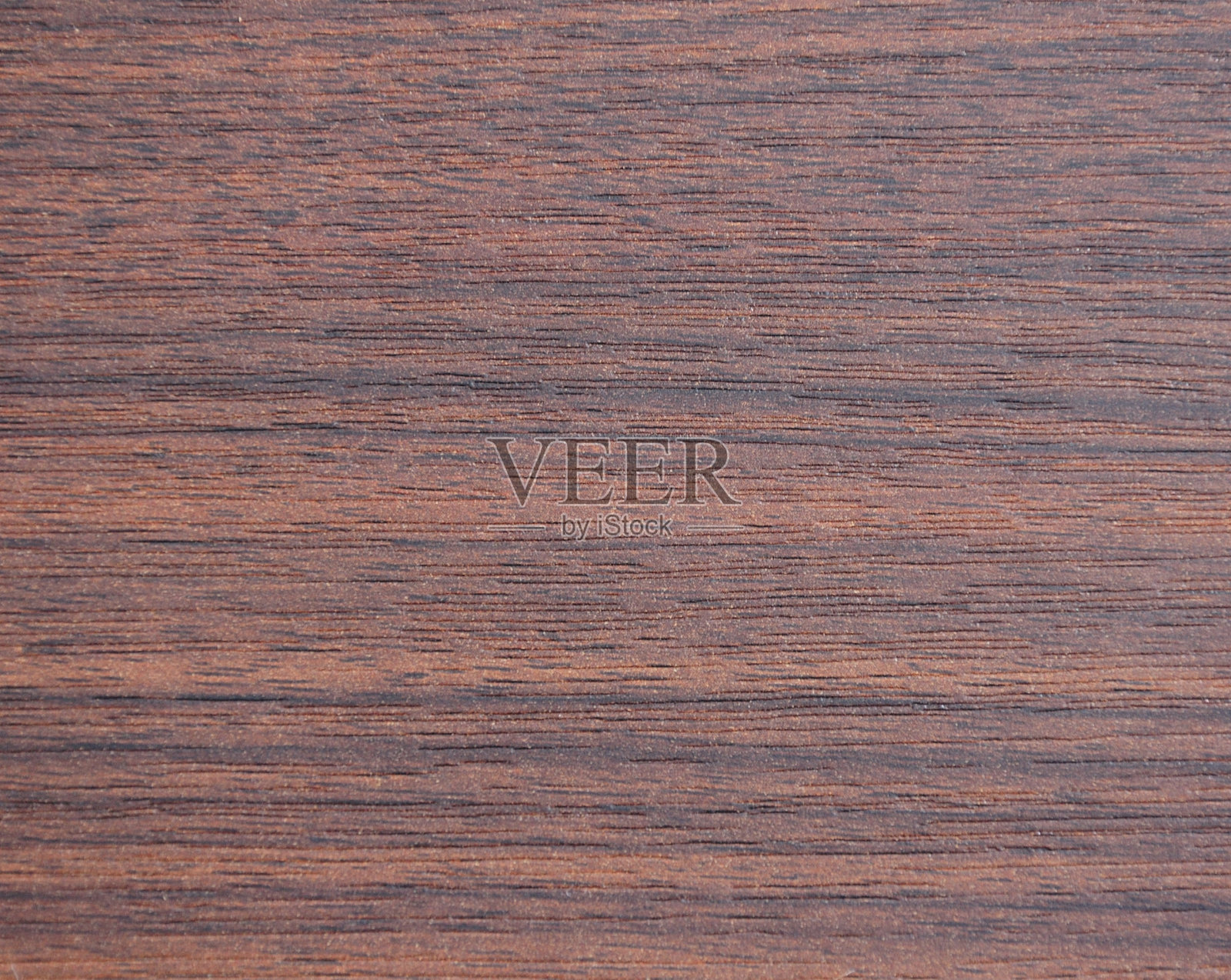 深色胡桃木，天然木材的纹理画在锯子上的特写。照片摄影图片