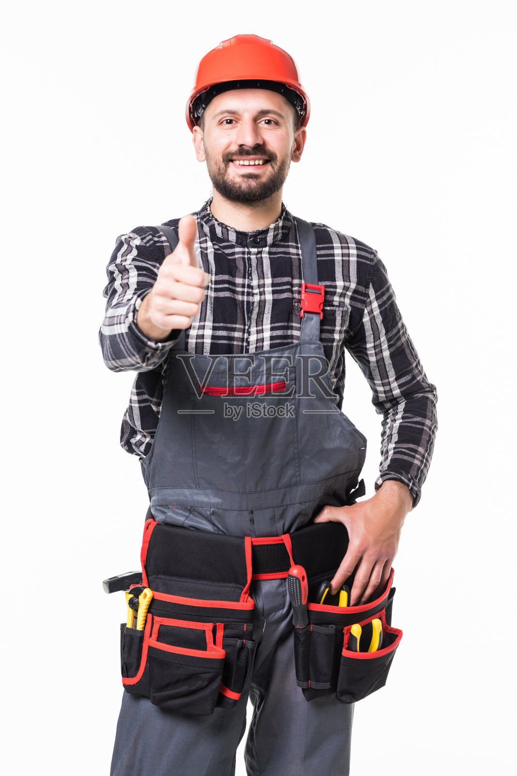 自信的年轻体力劳动者在白色背景下竖起大拇指照片摄影图片