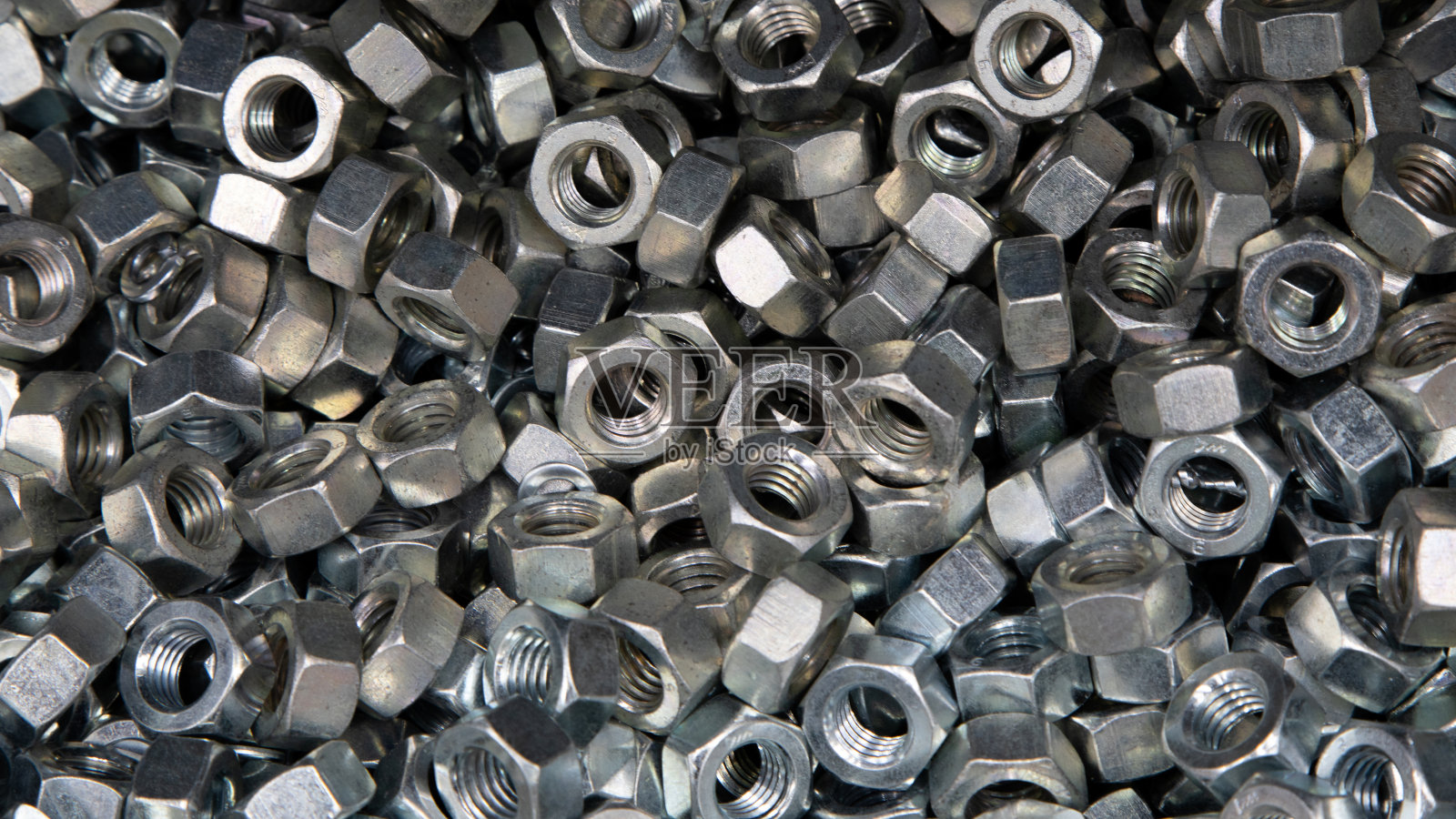 坚果。纹理。很多用于螺栓和螺丝的橡胶螺母。背景墙纸。照片摄影图片