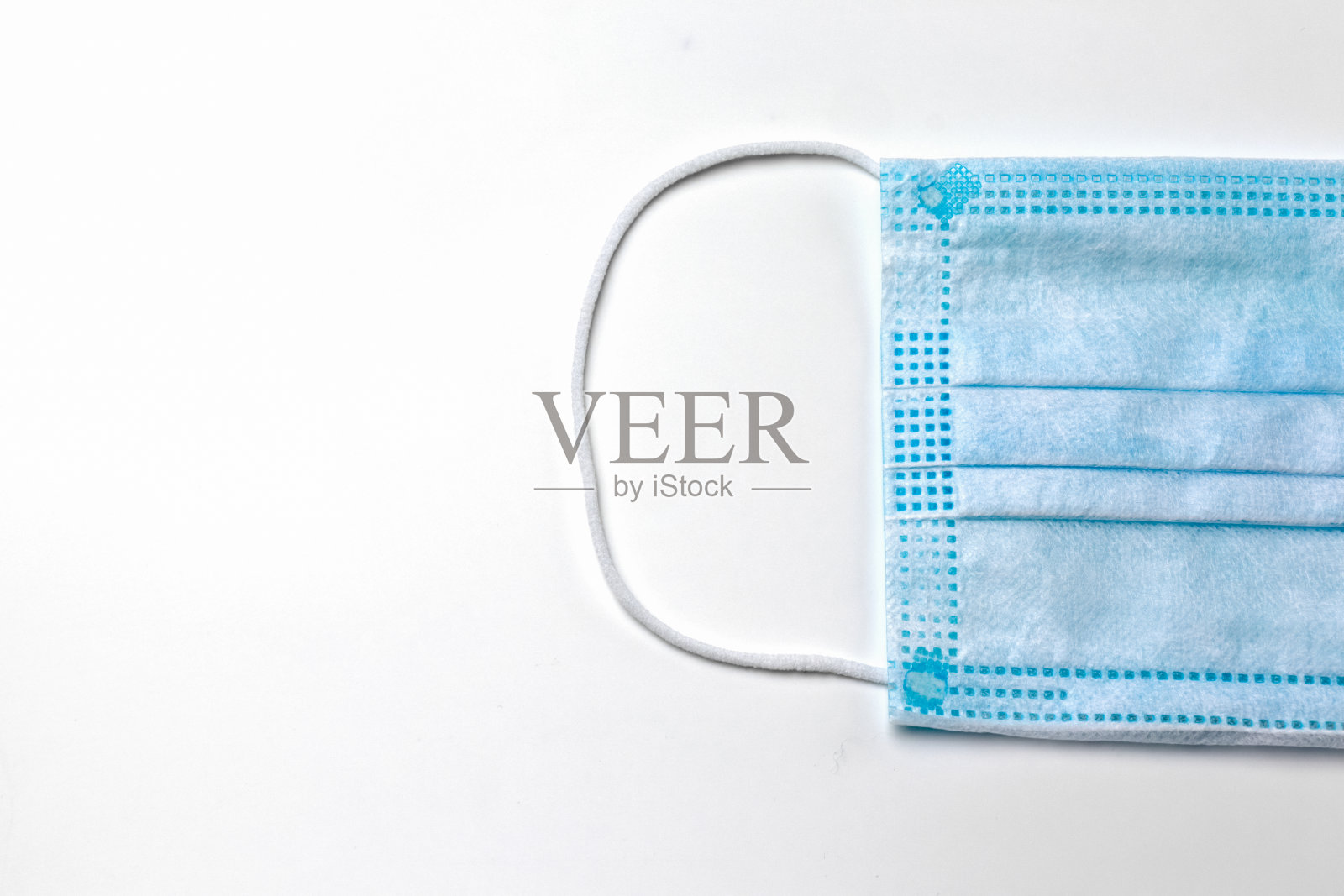 医用口罩上的白色背景隔离宏照片摄影图片