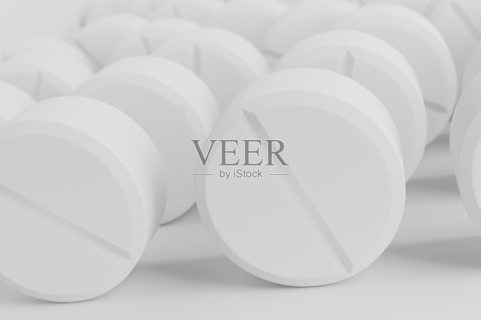 白色背景上的一堆圆形药丸。照片摄影图片