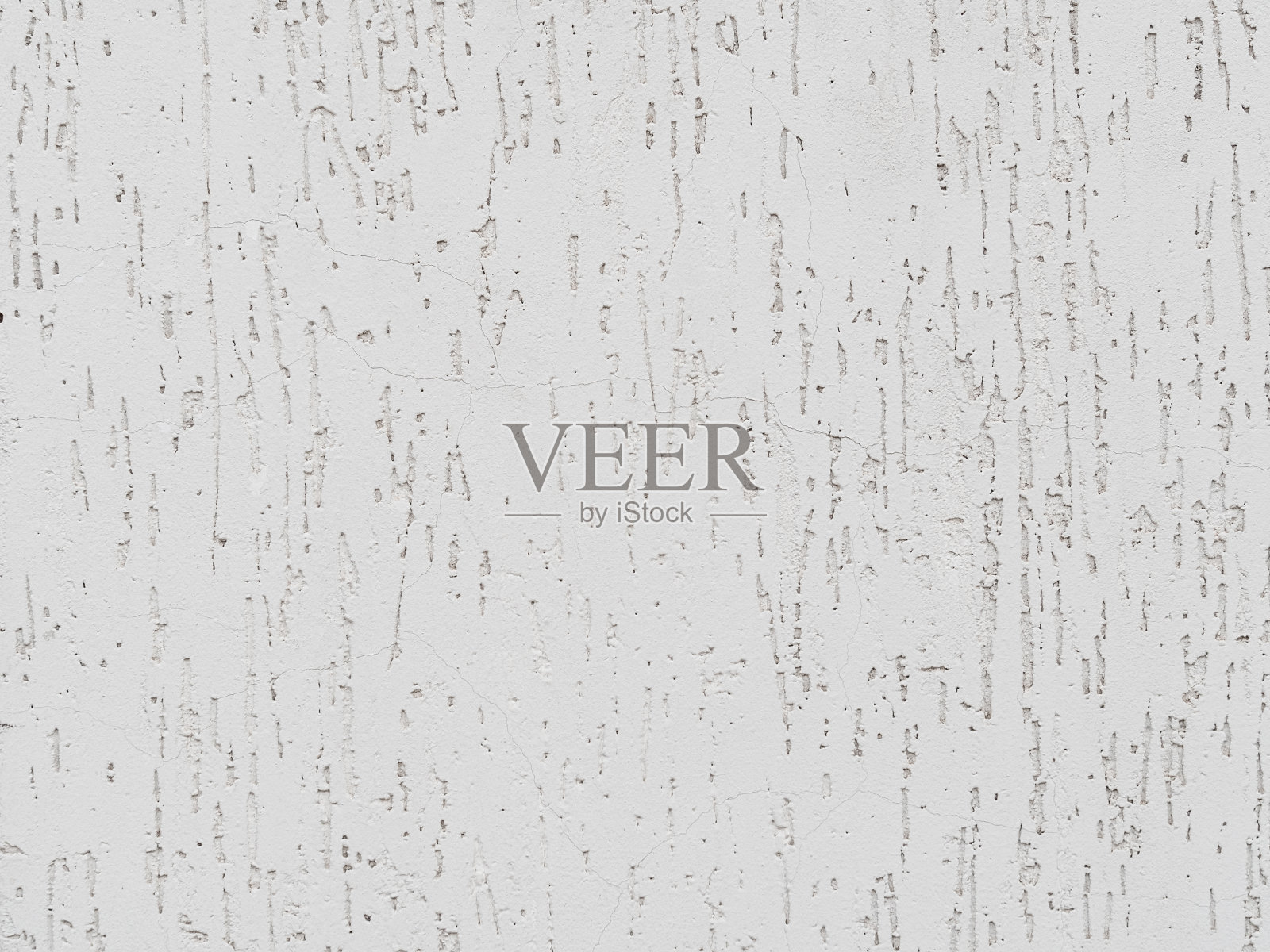 墙面白色灰泥上的裂缝和凹坑-纹理照片摄影图片