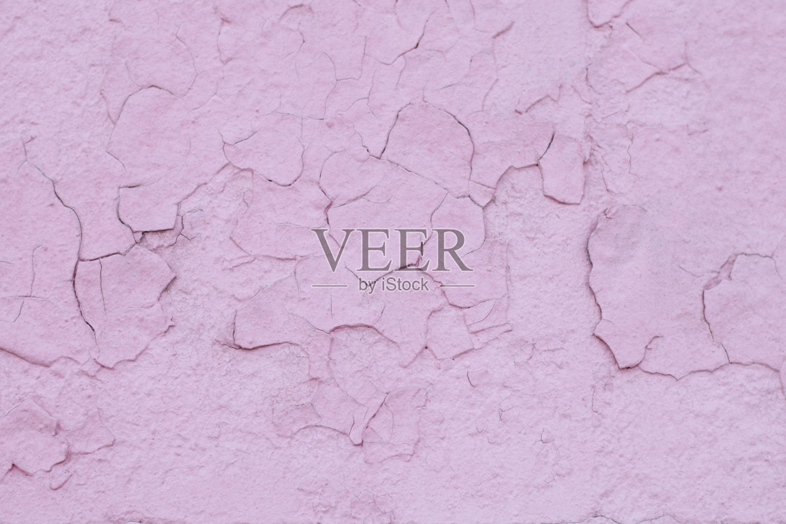 墙上涂着破旧的粉红色油漆，还拍了特写照片摄影图片