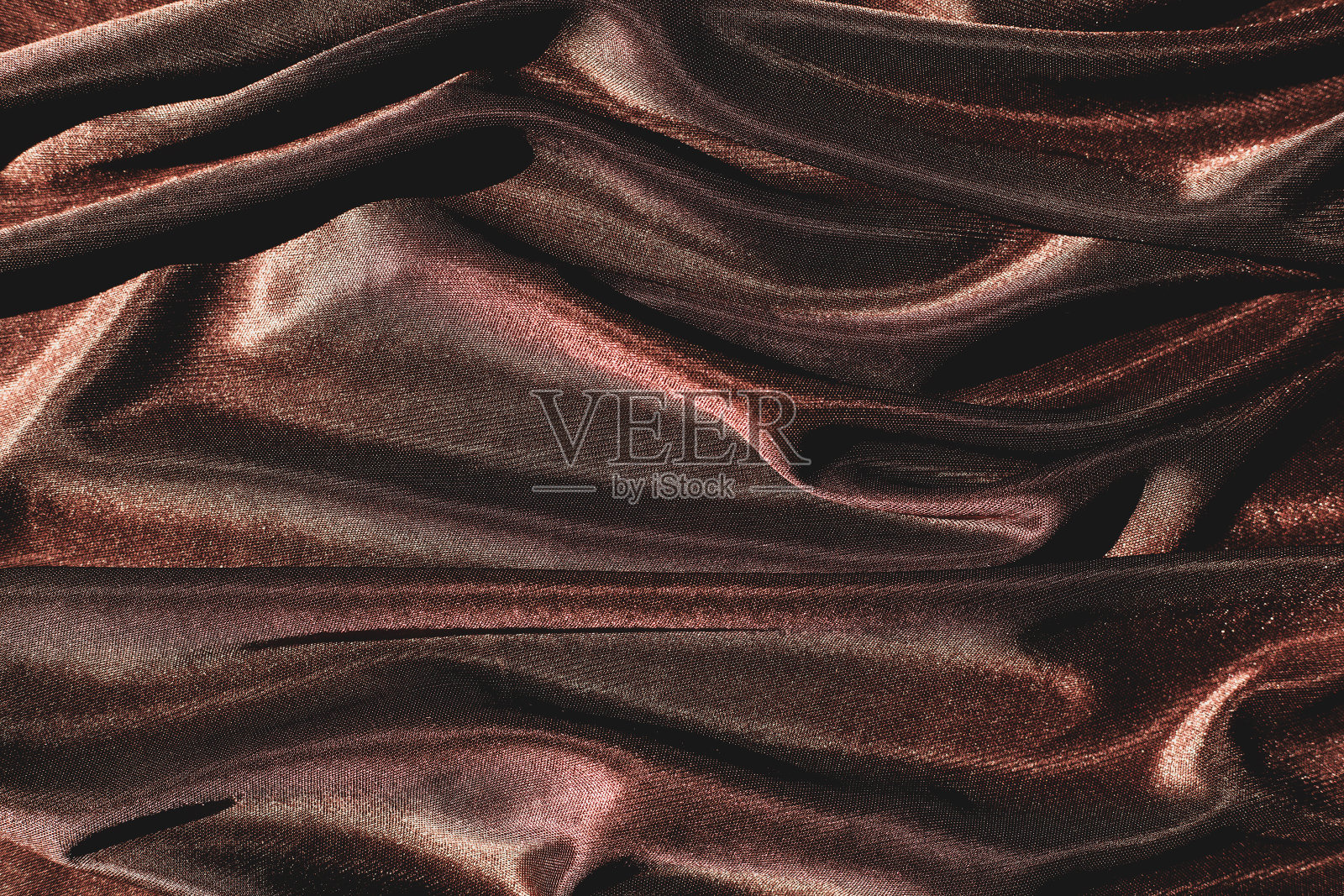 光滑优雅的棕色丝绸或缎子纹理可以用作抽象的背景照片摄影图片