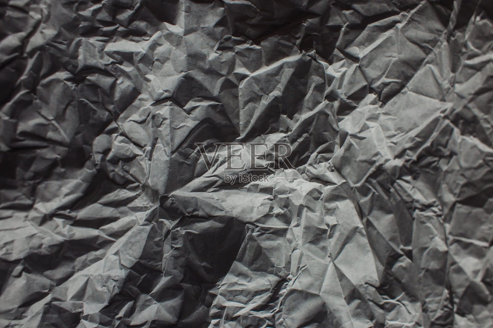 白色纹理背景。皱巴巴的纸照片摄影图片