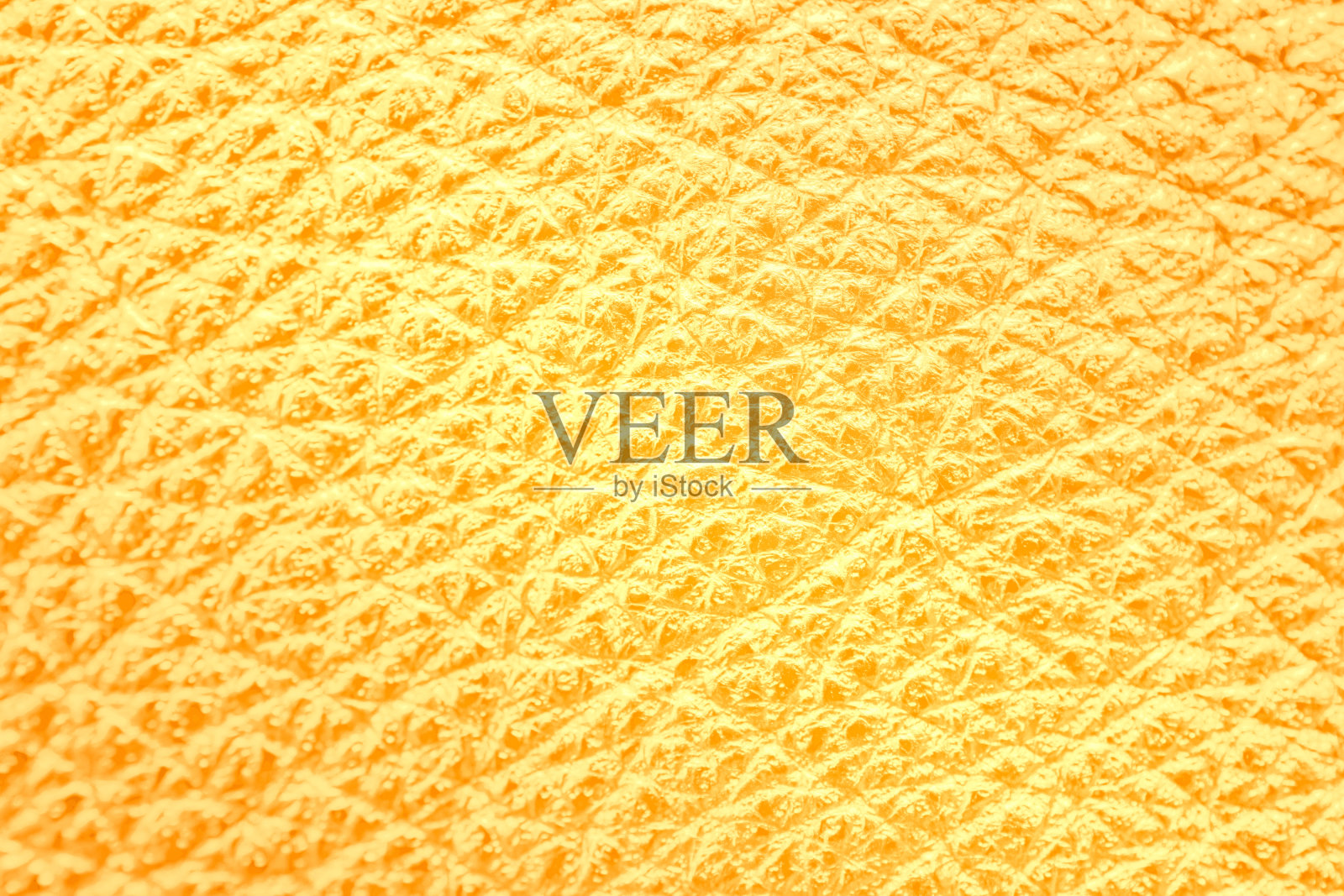 金色皮革纹理背景，近距离照片摄影图片