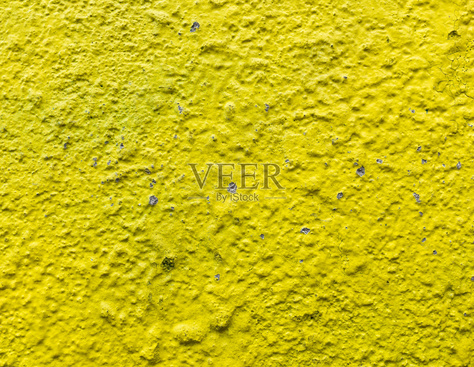 墙的底色是黄色的。照片摄影图片