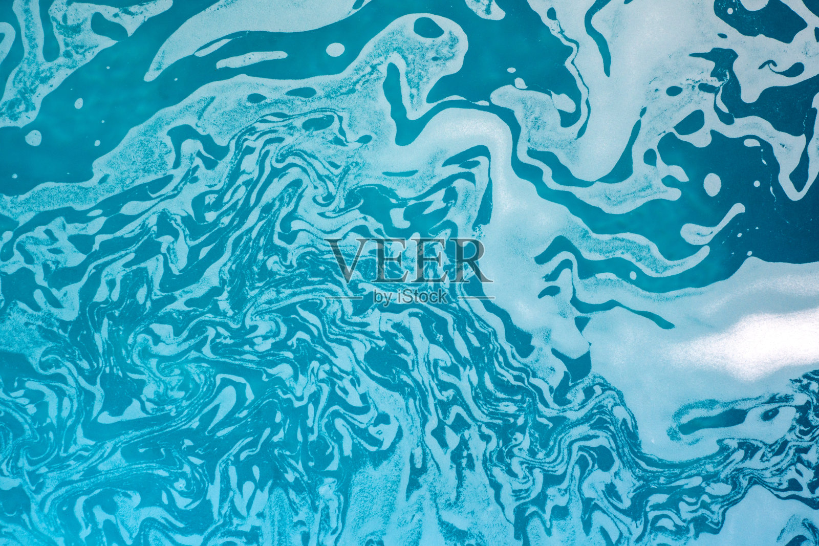 绿松石背景上的白色污渍照片摄影图片