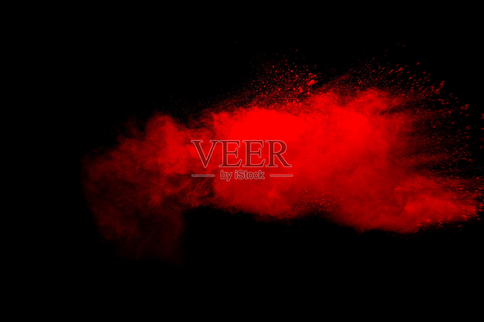 摘要黑色背景下的红尘爆炸。冻结运动的红色粉末飞溅。照片摄影图片