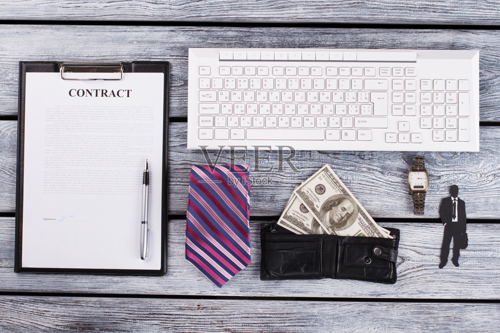 签了合同，钱和领带。照片摄影图片